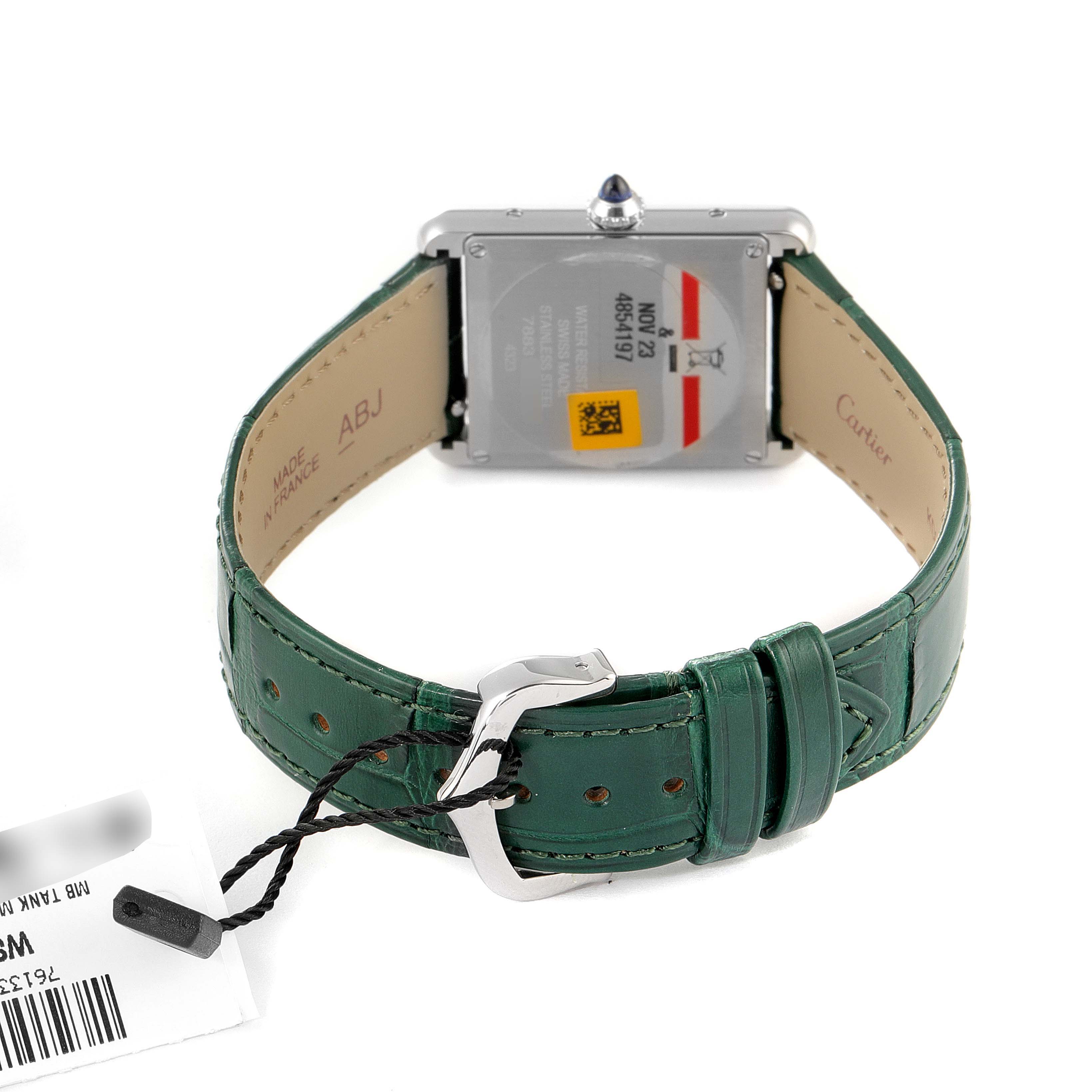 The image shows the back view of a Cartier Tank Must WSTA0056 Women's Stainless Steel Green Dial WSTA0056 Women's Stainless Steel Green Dial watch, detailing the green leather strap and metal buckle.