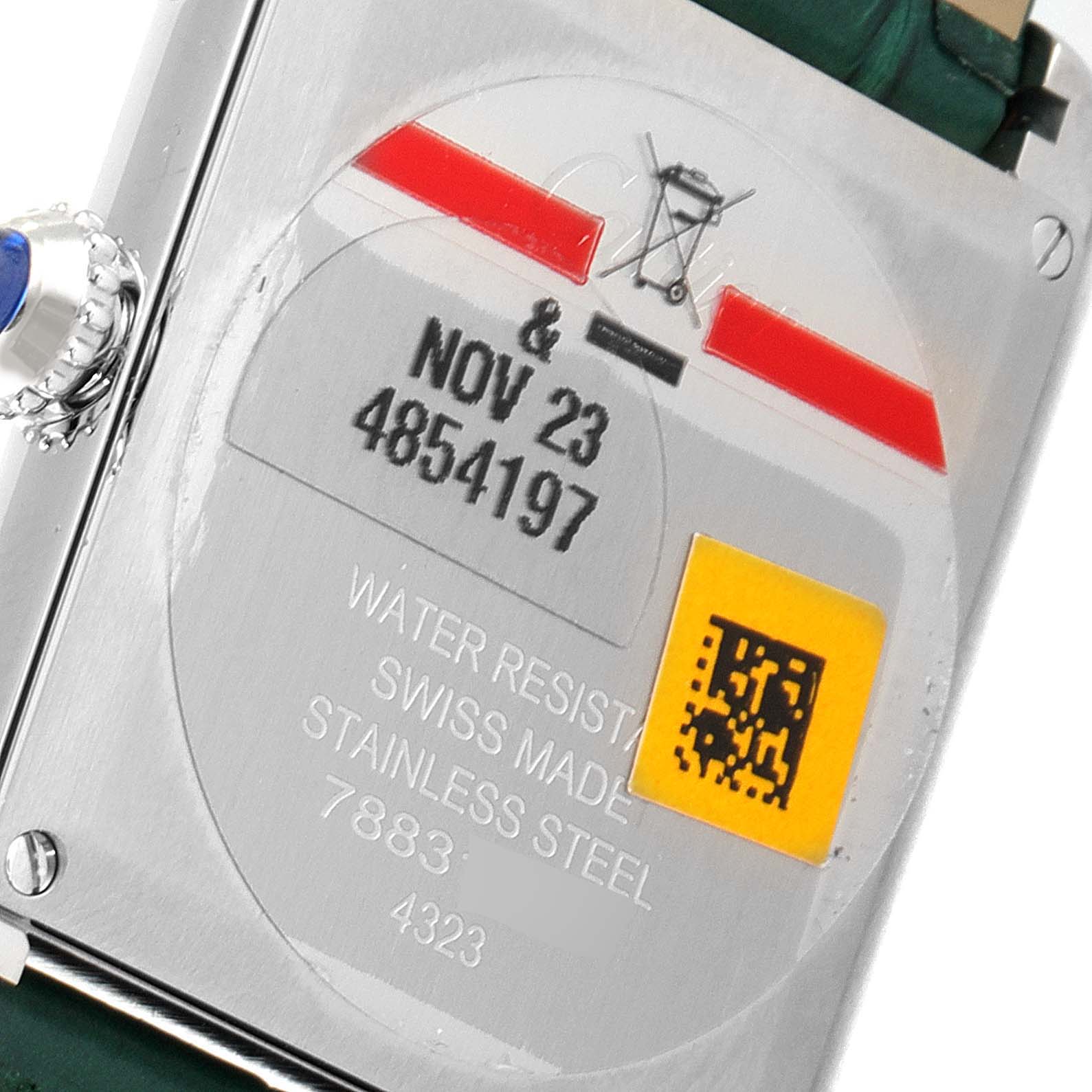 This image shows the back view of the Cartier Tank Must WSTA0056 Women's Stainless Steel Green Dial WSTA0056 Women's Stainless Steel Green Dial model watch, highlighting the case back details and inscriptions.