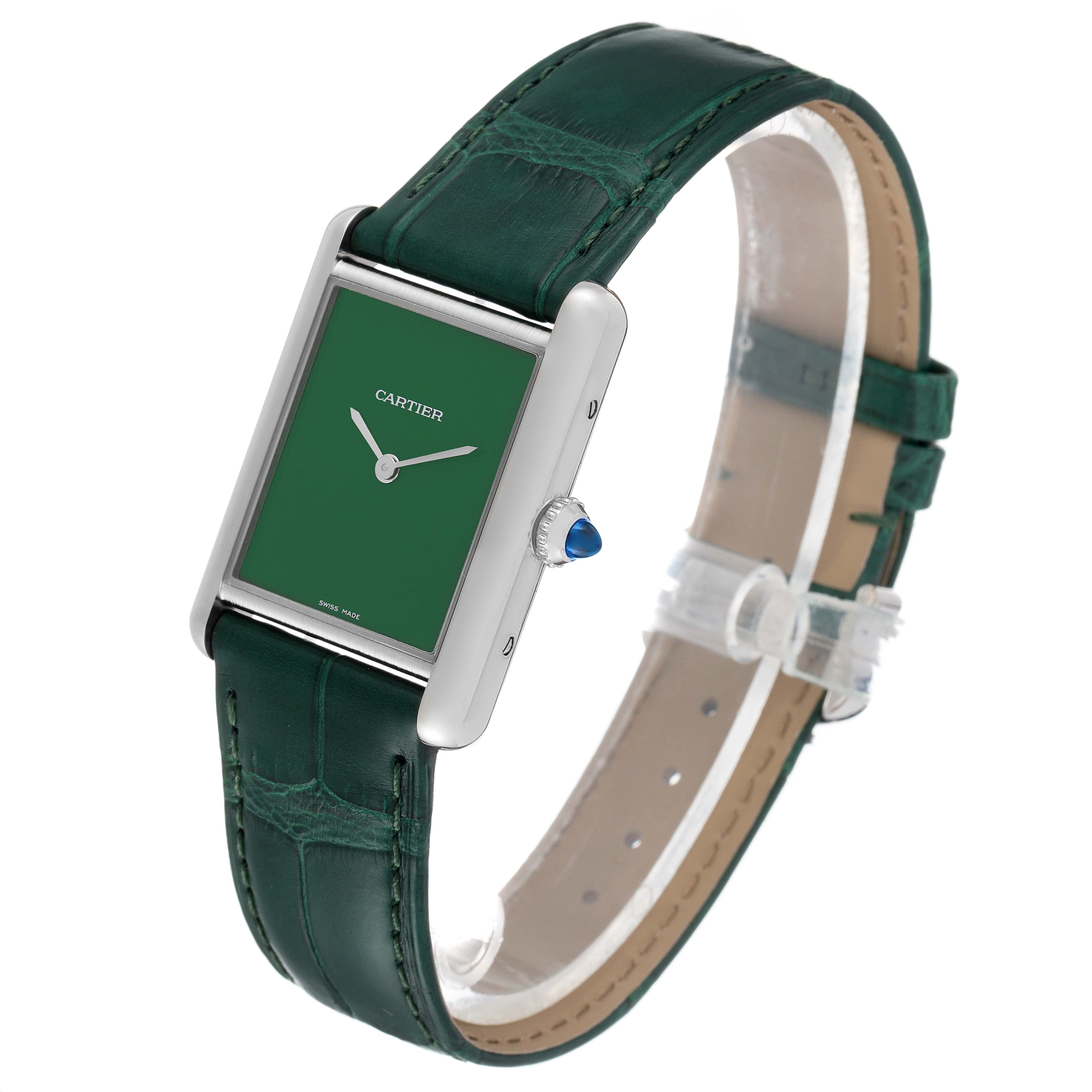 The image shows a side-view angle of a Tank Must model watch by Cartier, featuring a green leather strap and a green dial.