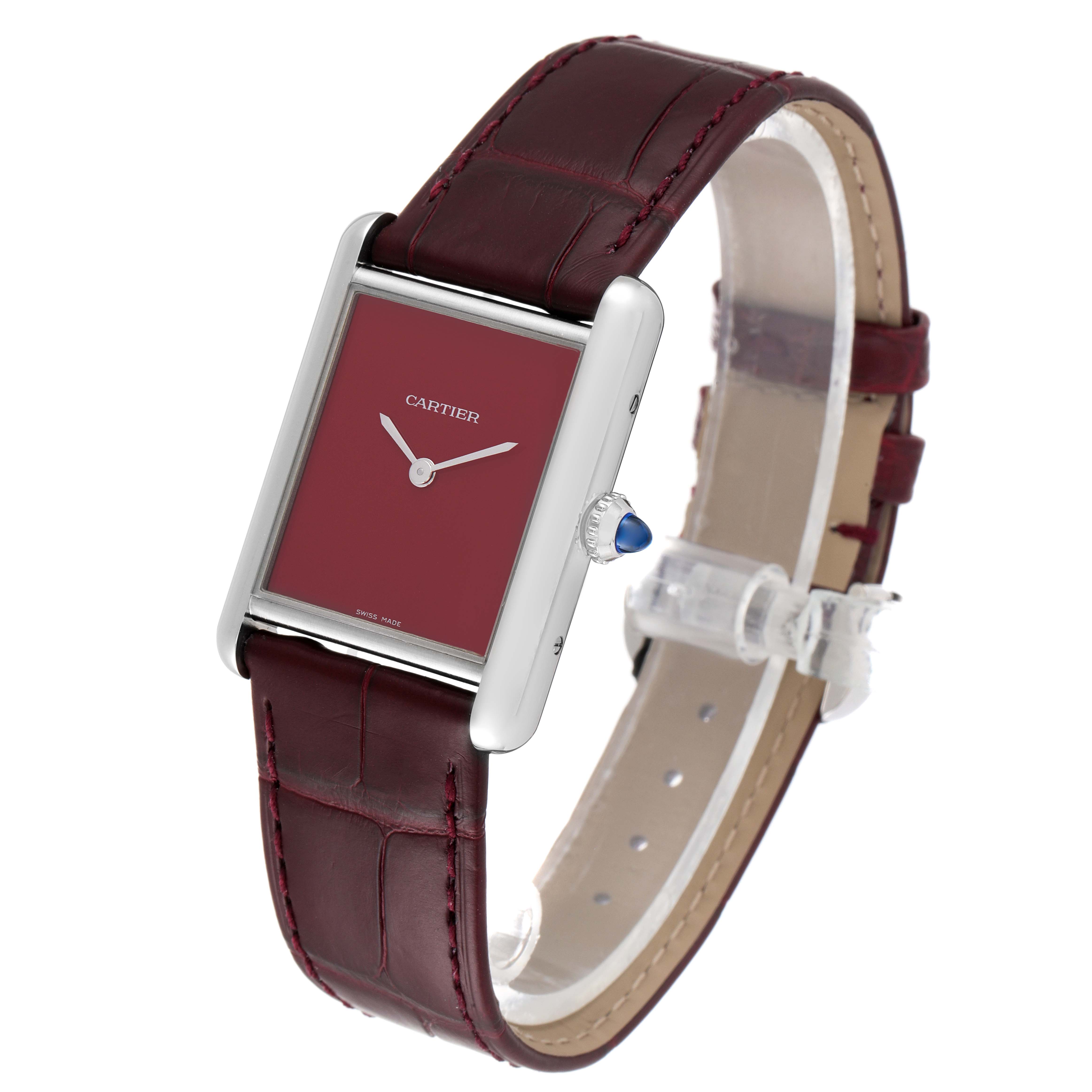 The image shows a Cartier Tank Must WSTA0054 Women's Stainless Steel Red Dial WSTA0054 Women's Stainless Steel Red Dial watch at a 3/4 angle, highlighting the face, crown, and strap.