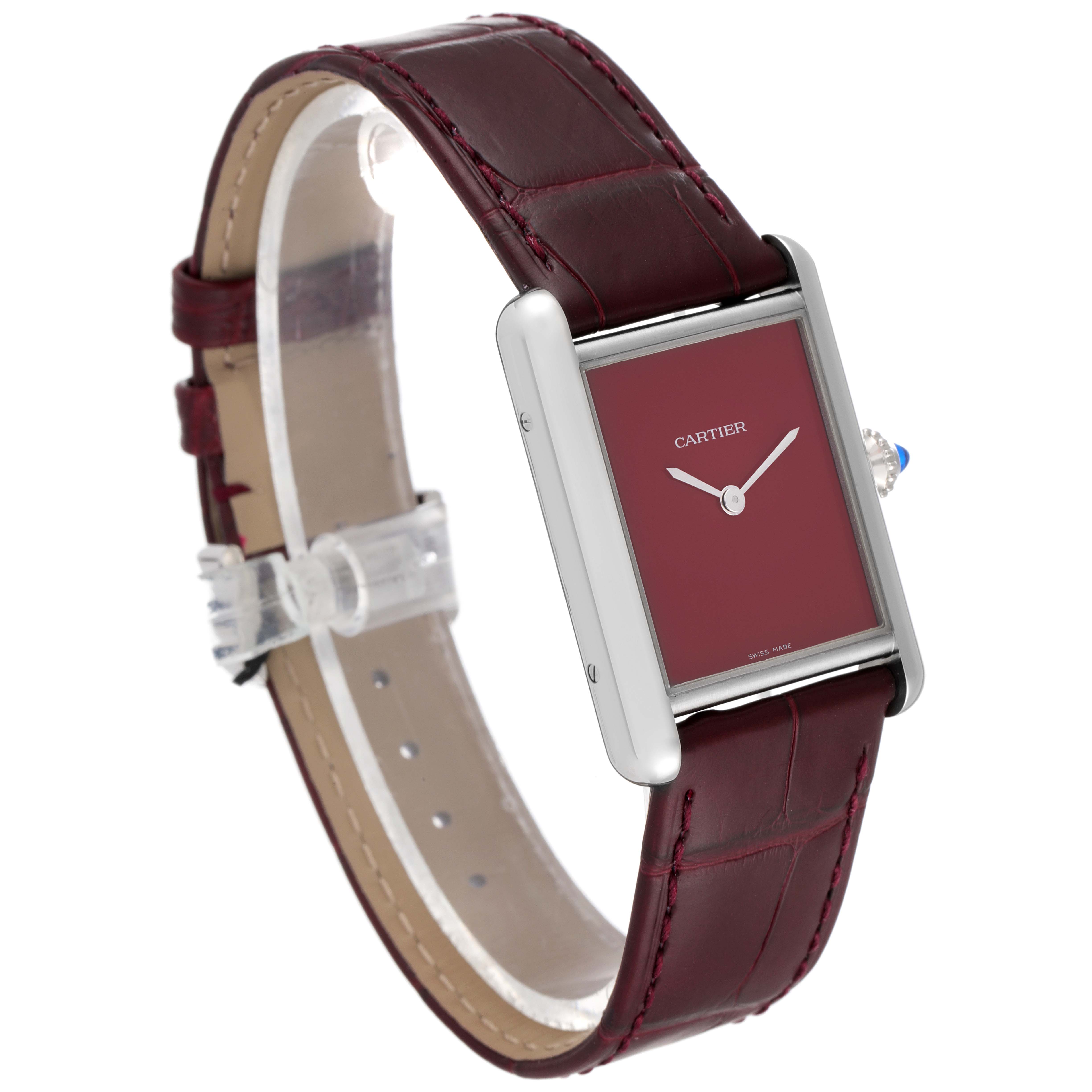 The image shows a Cartier Tank Must WSTA0054 Women's Stainless Steel Red Dial WSTA0054 Women's Stainless Steel Red Dial model watch from a three-quarter front side angle, highlighting the burgundy dial and strap.
