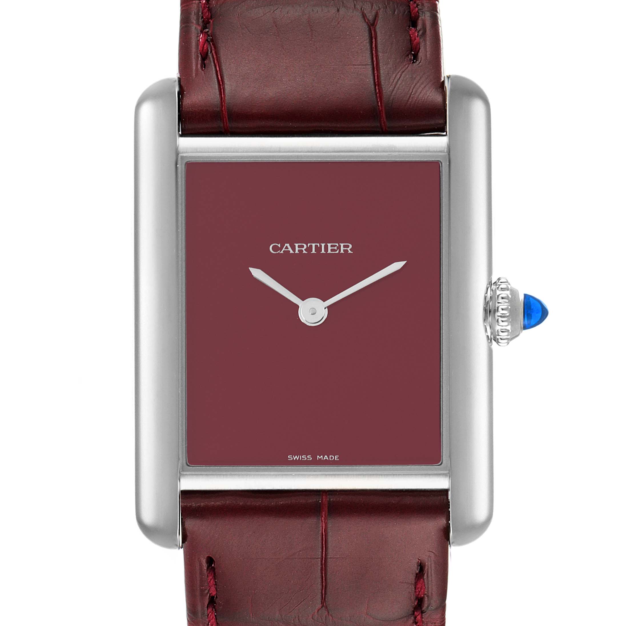 The image shows a Tank Must model by Cartier from a front angle, illustrating the dial, bezel, crown, and part of the strap.