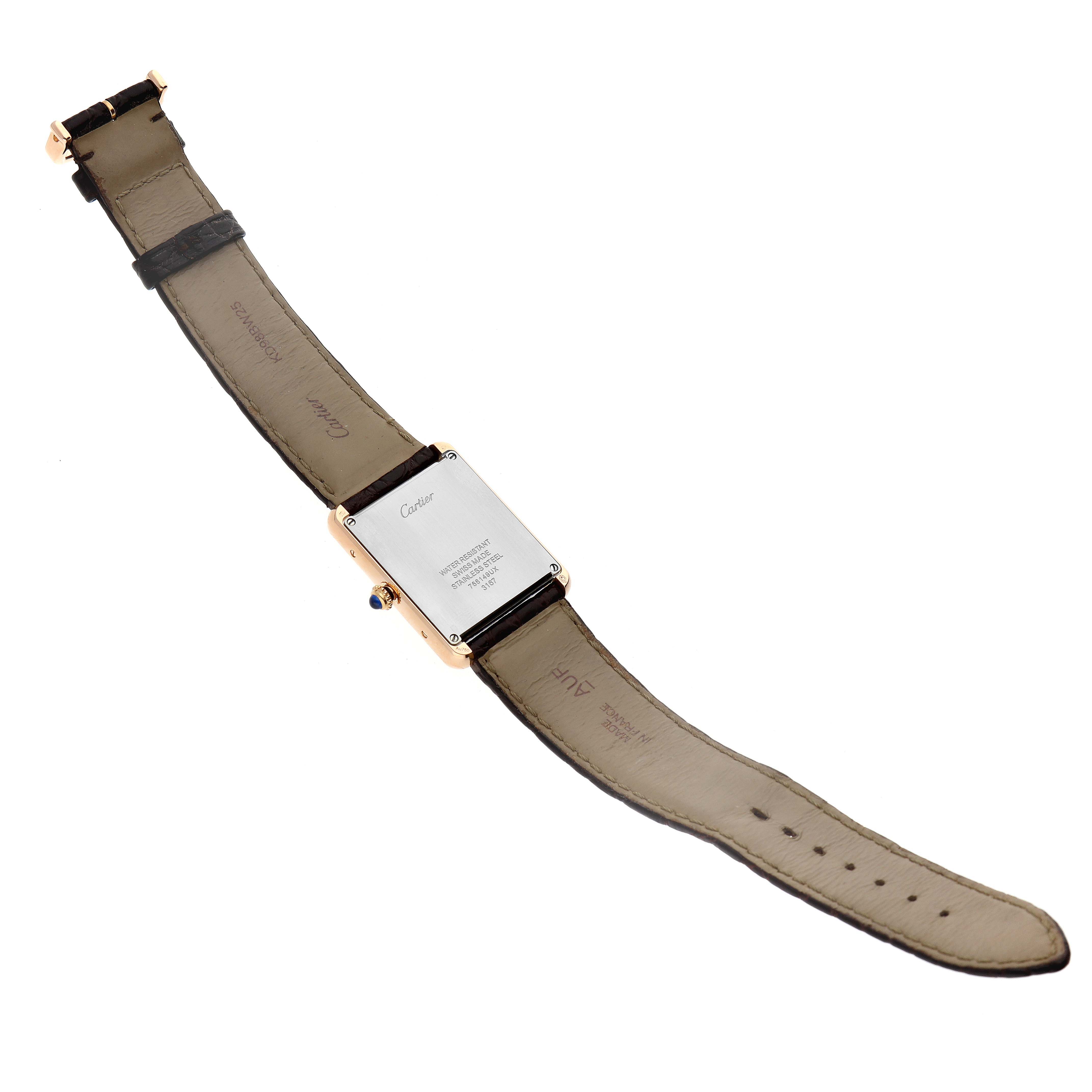 The image shows the back side and straps of a Cartier Tank Solo W5200025 Men's Steel and Gold (two tone) Silver Dial W5200025 Men's Steel and Gold (two tone) Silver Dial watch laid out flat.