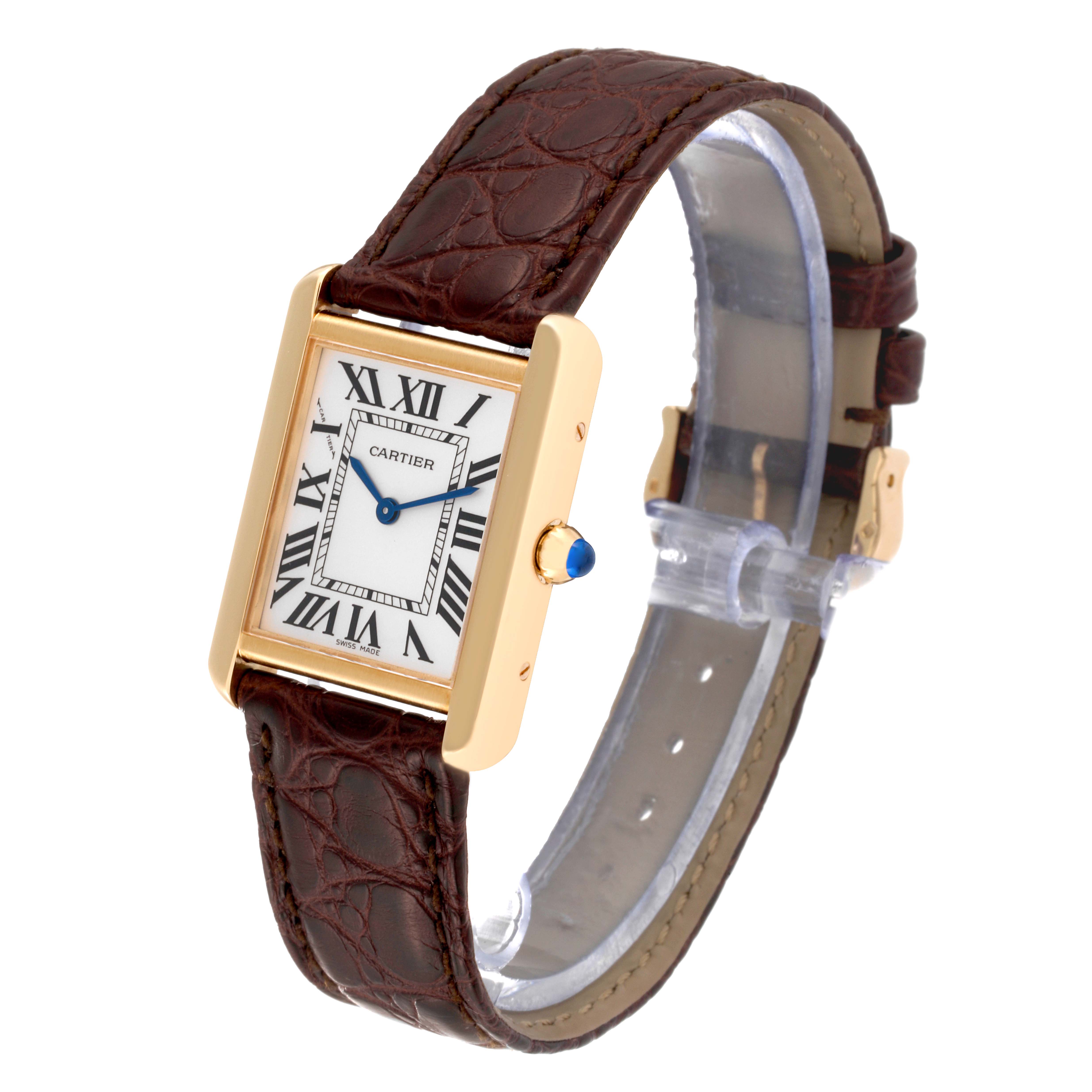 This Cartier Tank Solo W1018755 Women
s Steel and Gold (two tone) Silver Dial W1018755 Women
s Steel and Gold (two tone) Silver Dial watch is shown at a three-quarter angle, displaying its rectangular face, Roman numerals, crown, and leather strap.
