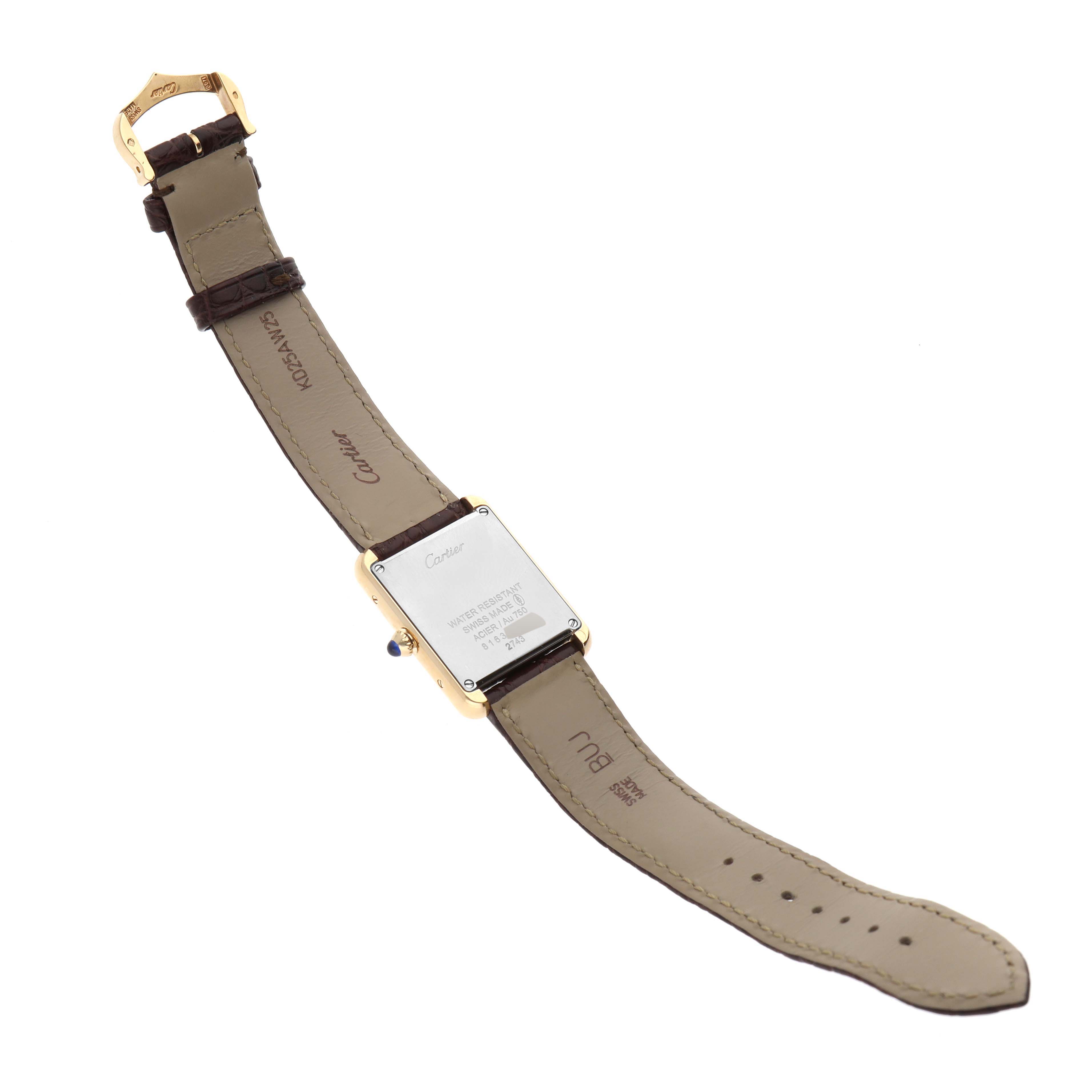 The image shows the back of a Tank Solo watch by Cartier, displaying its case back, strap, and buckle.