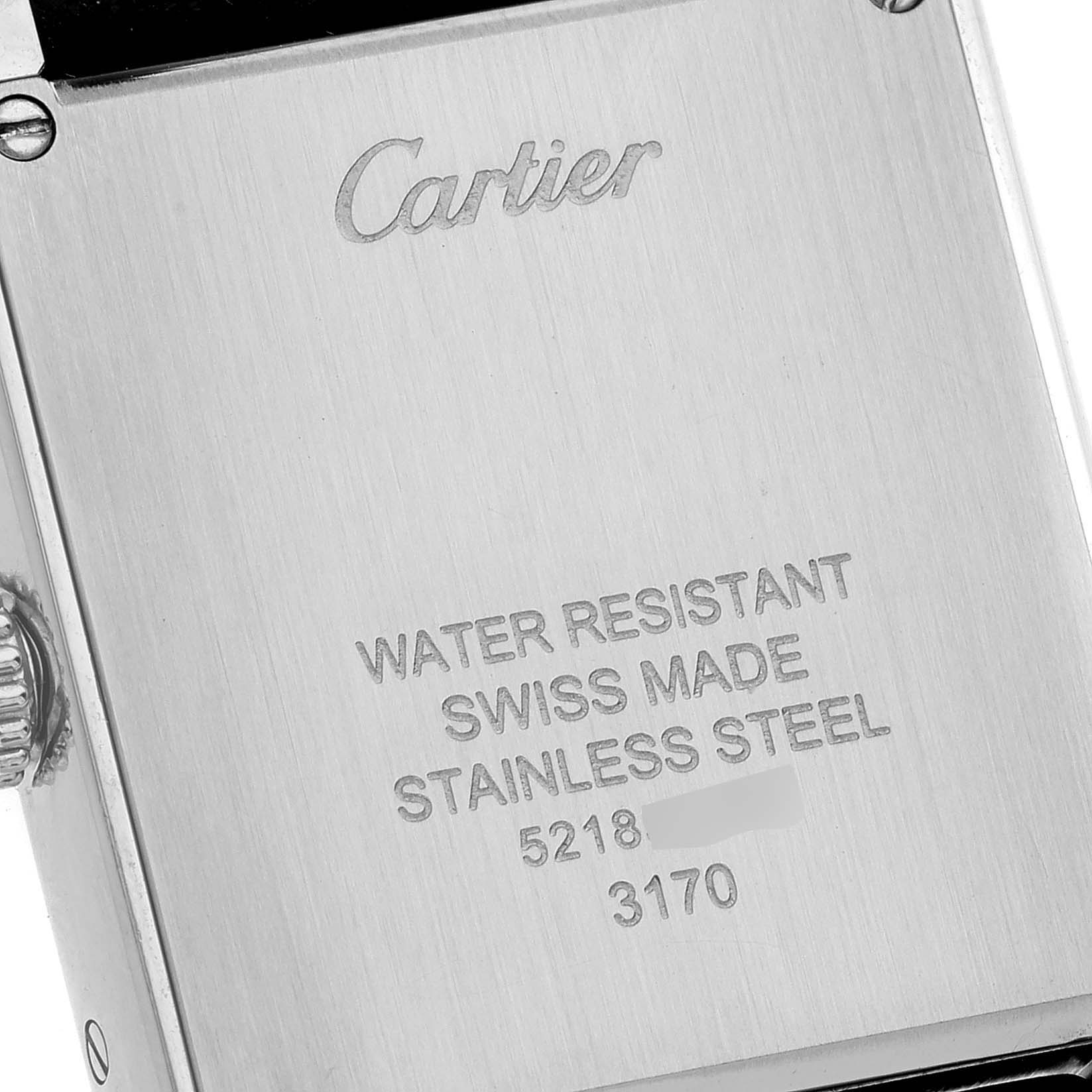 The image shows the stainless steel case back of the Cartier Tank Solo W5200005 Women
s Stainless Steel Silver Dial W5200005 Women
s Stainless Steel Silver Dial watch at an angle.