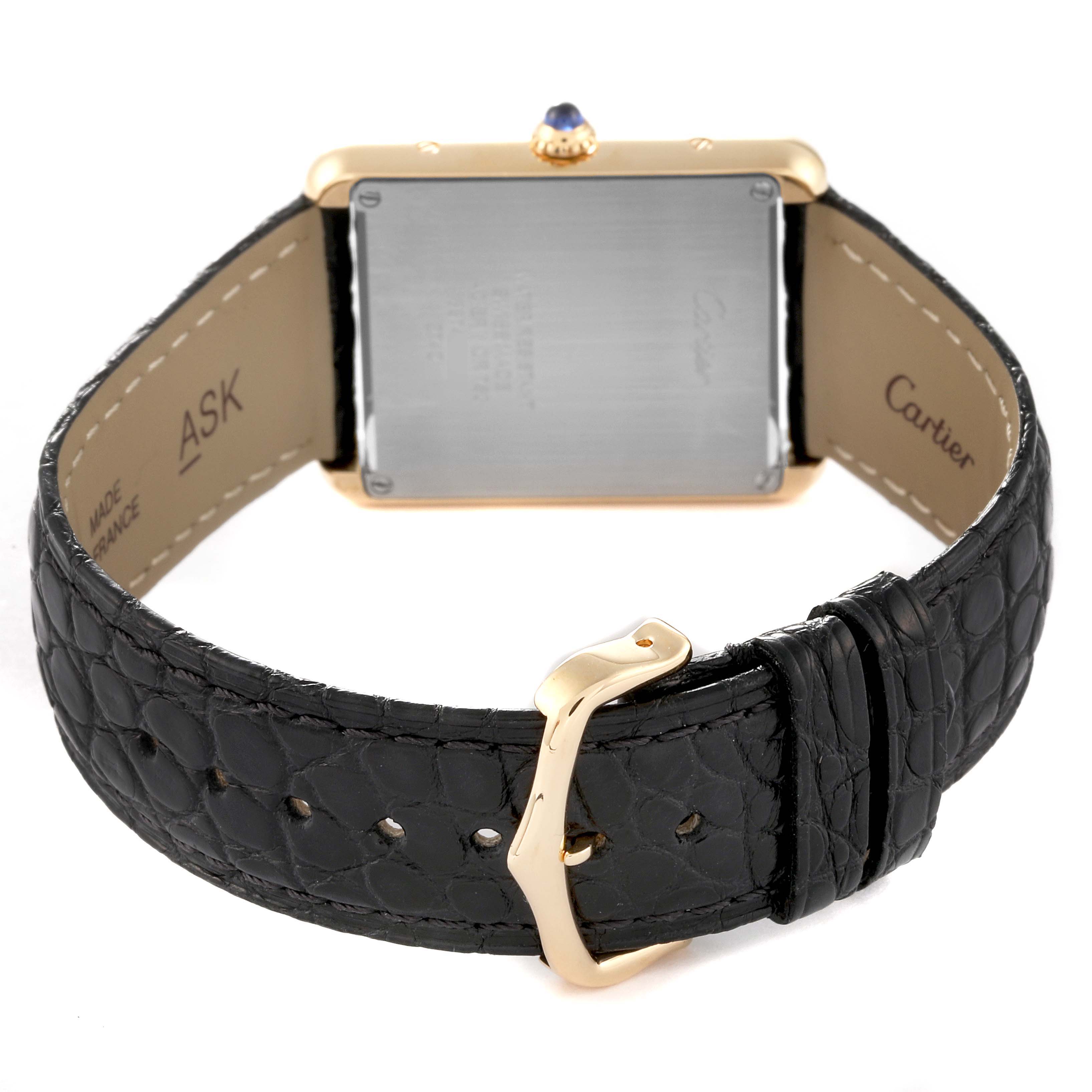 This image shows the back view of a Cartier Tank Solo W1018855 Men
s Steel and Gold (two tone) Silver Dial W1018855 Men
s Steel and Gold (two tone) Silver Dial watch, highlighting its case back, black leather strap, and gold buckle.