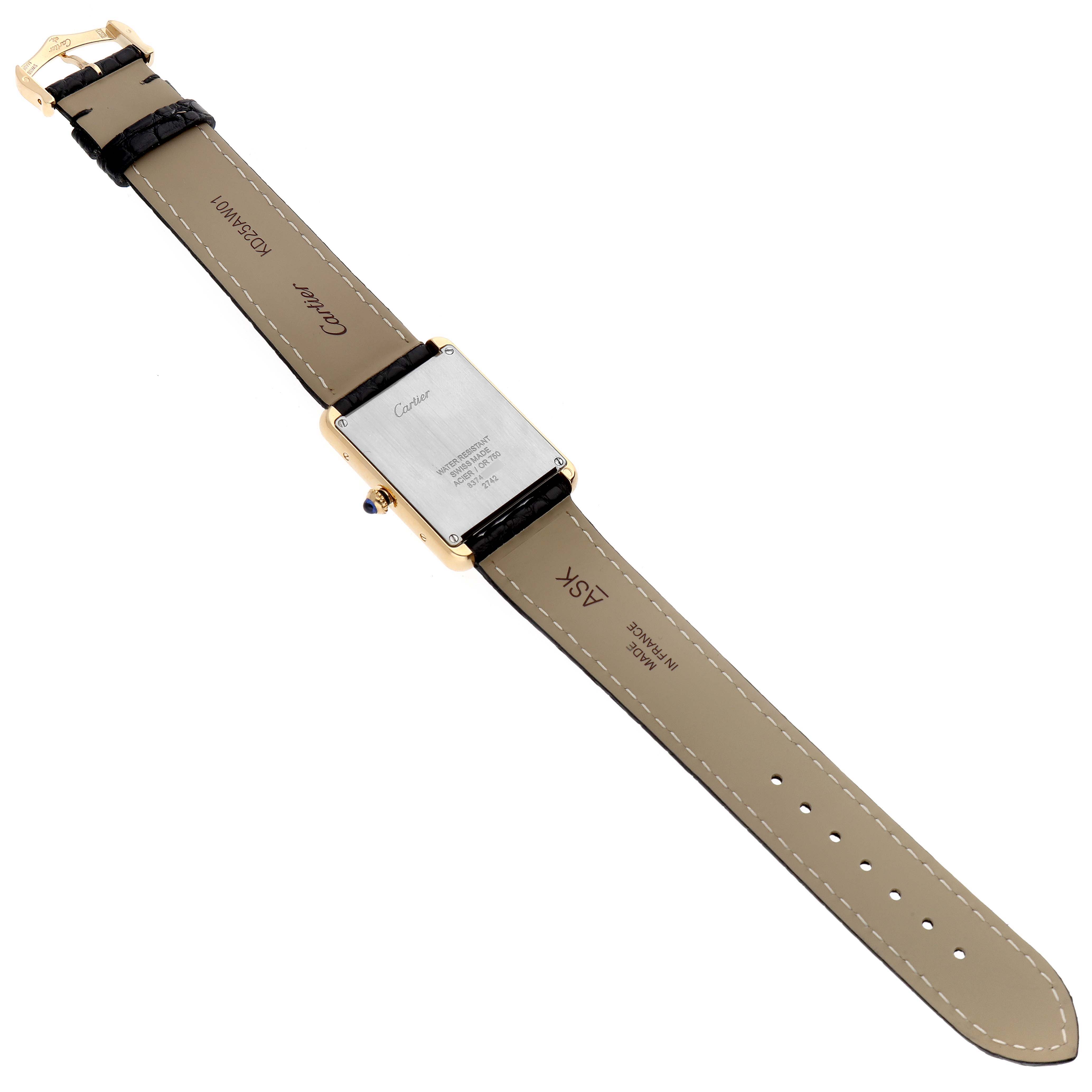 This image shows the back and strap of a Cartier Tank Solo W1018855 Men
s Steel and Gold (two tone) Silver Dial W1018855 Men
s Steel and Gold (two tone) Silver Dial watch laid flat, displaying the case back and buckle.