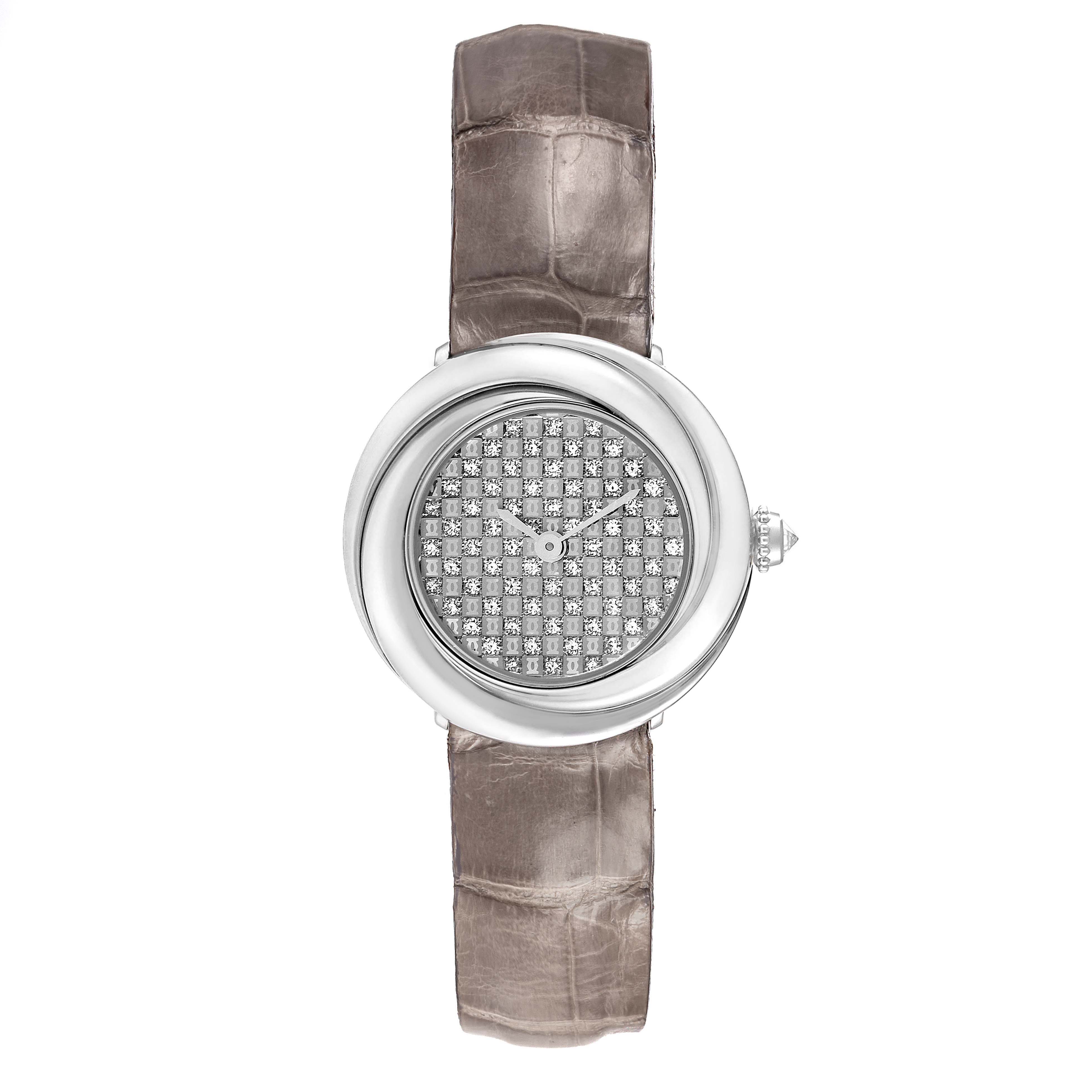 The Cartier Trinity WG201156 Women's White Gold  watch is shown from a top angle, featuring a diamond-encrusted dial and a leather strap.