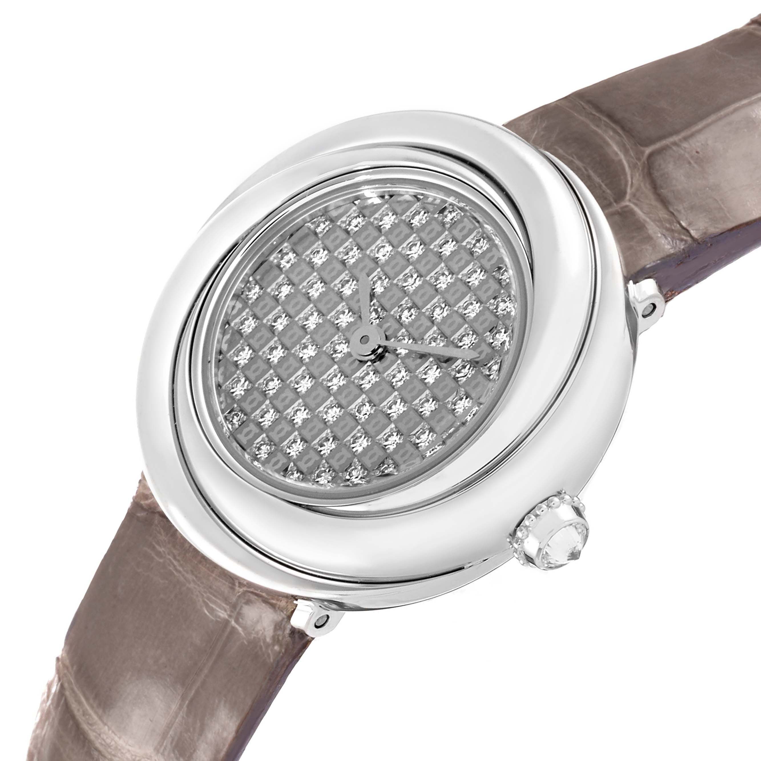 The Cartier Trinity WG201156 Women's White Gold  watch is shown from an oblique angle, highlighting its diamond-patterned dial, polished case, and crown.