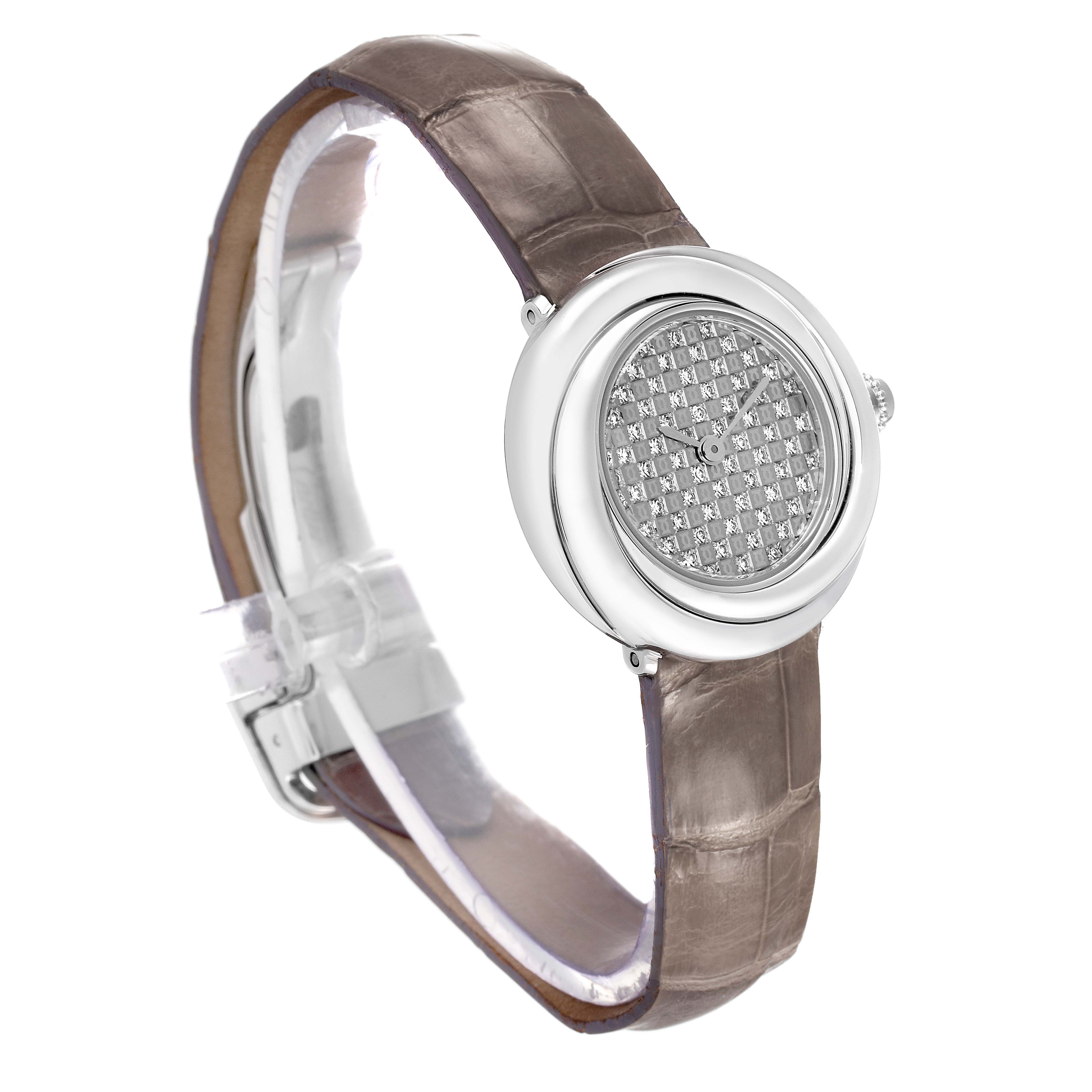 The Cartier Trinity WG201156 Women's White Gold  watch is shown from a three-quarter angle, highlighting its round dial, silver bezel, and brown leather strap.