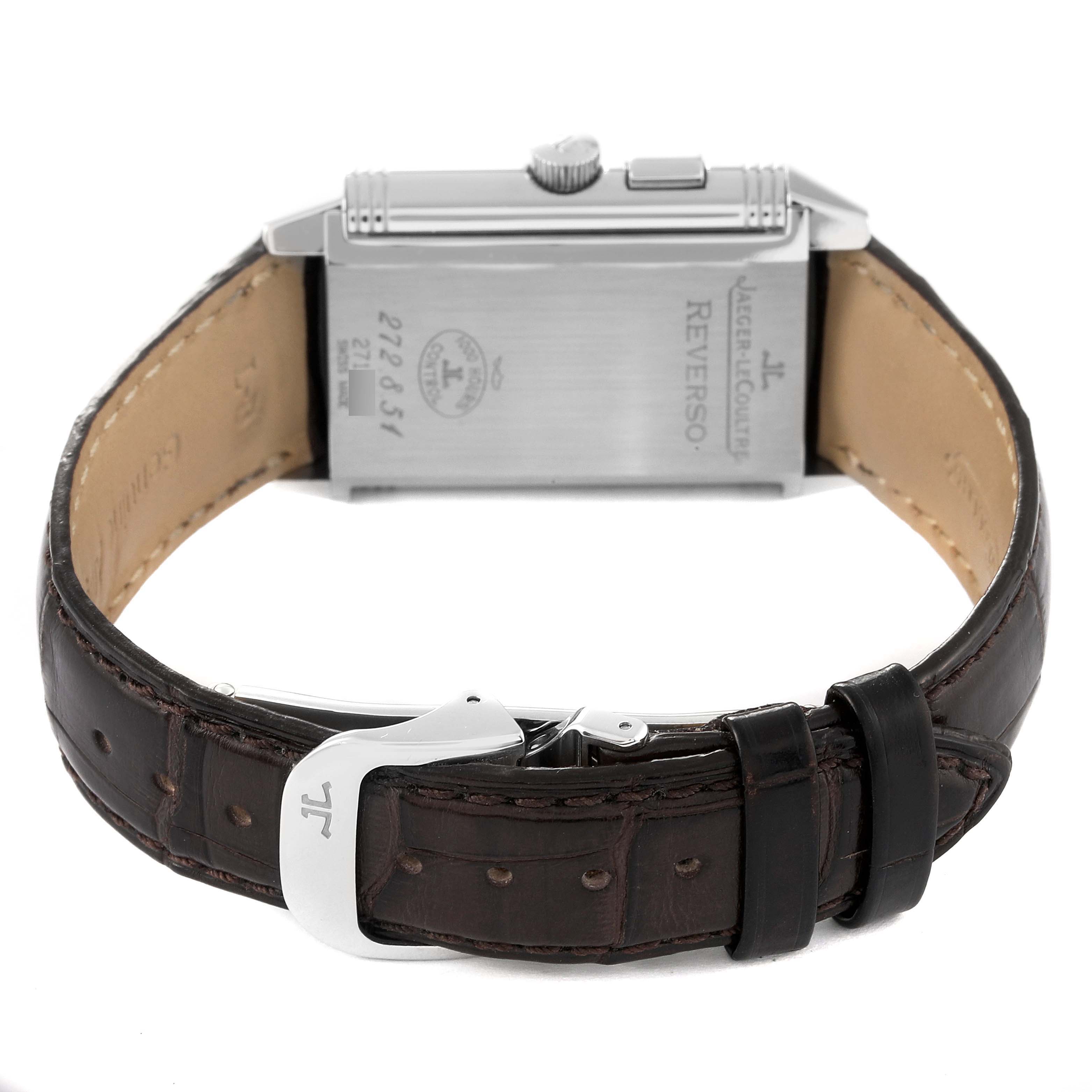 The image shows the back of a Jaeger LeCoultre Reverso Q2718410 Men's Stainless Steel Silver Dial Q2718410 Men's Stainless Steel Silver Dial watch, focusing on its case, crown, and leather strap with a buckle.
