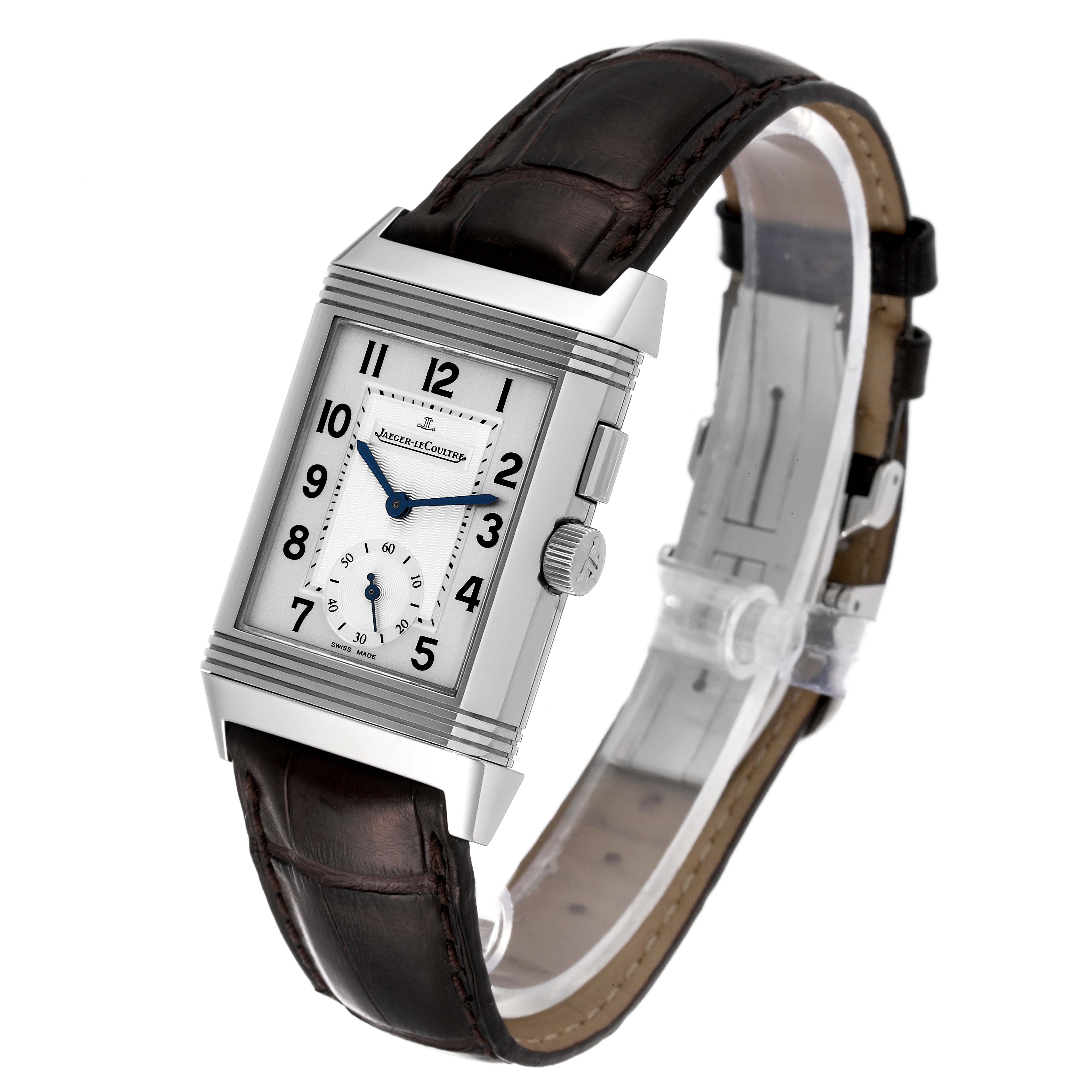 The image shows a three-quarter view of a Jaeger LeCoultre Reverso Q2718410 Men's Stainless Steel Silver Dial Q2718410 Men's Stainless Steel Silver Dial watch, featuring its rectangular case and leather strap.