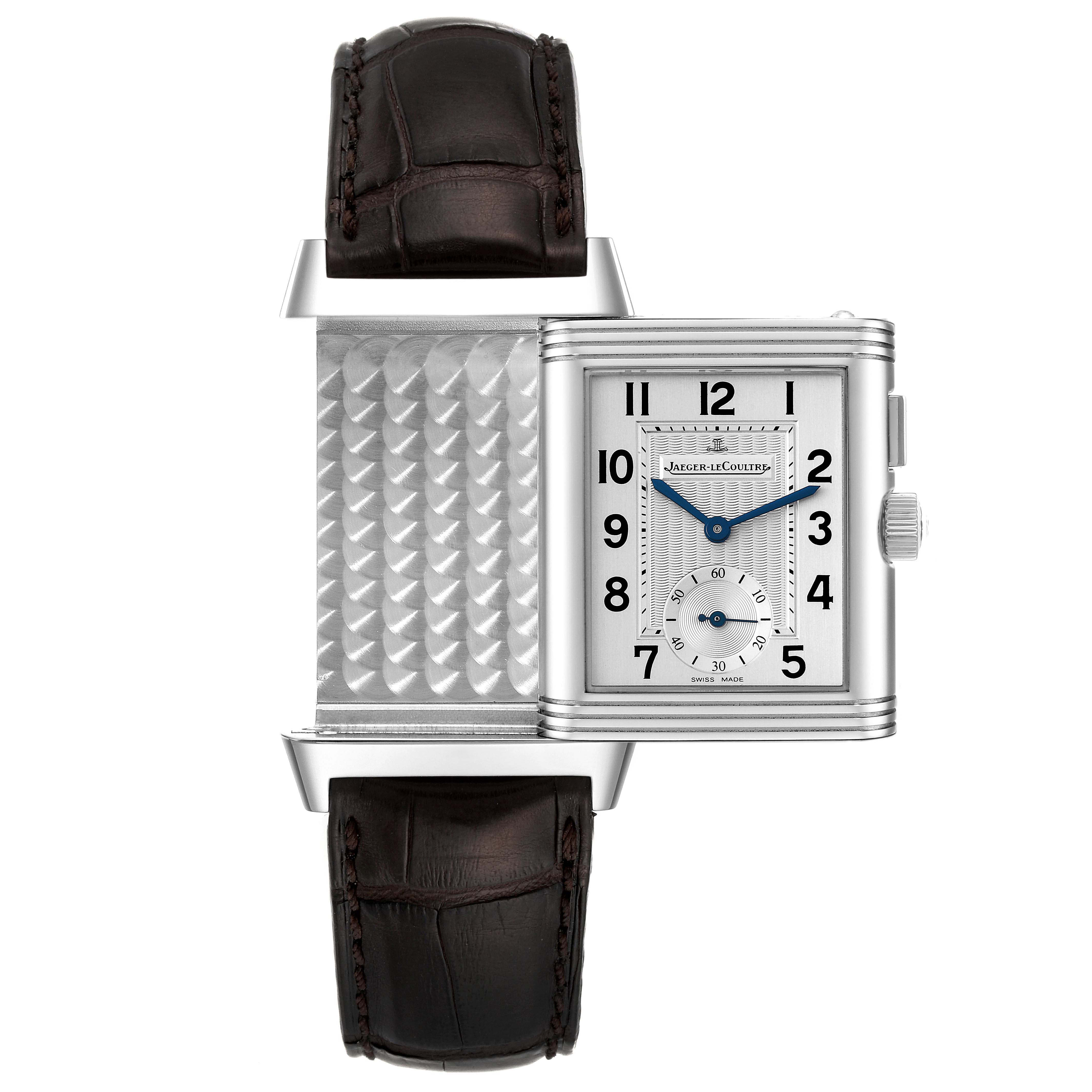 This image shows the Jaeger LeCoultre Reverso Q2718410 Men's Stainless Steel Silver Dial Q2718410 Men's Stainless Steel Silver Dial watch with its case partially flipped to reveal its intricate back pattern.