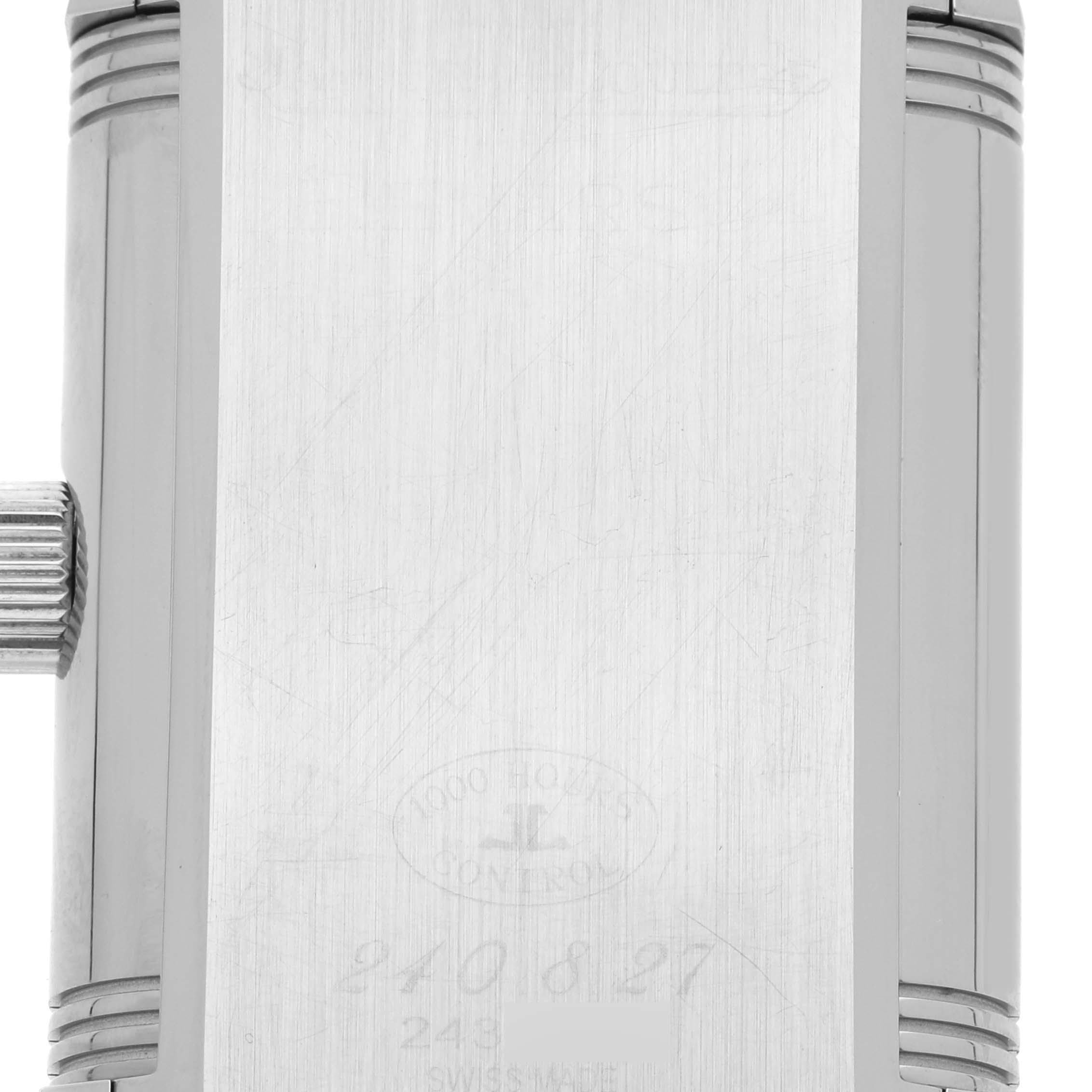 This image shows the case back and crown of a Jaeger LeCoultre Reverso Q3048420 Men
s Stainless Steel Silver Dial Q3048420 Men
s Stainless Steel Silver Dial watch, highlighting the model
s engravings.