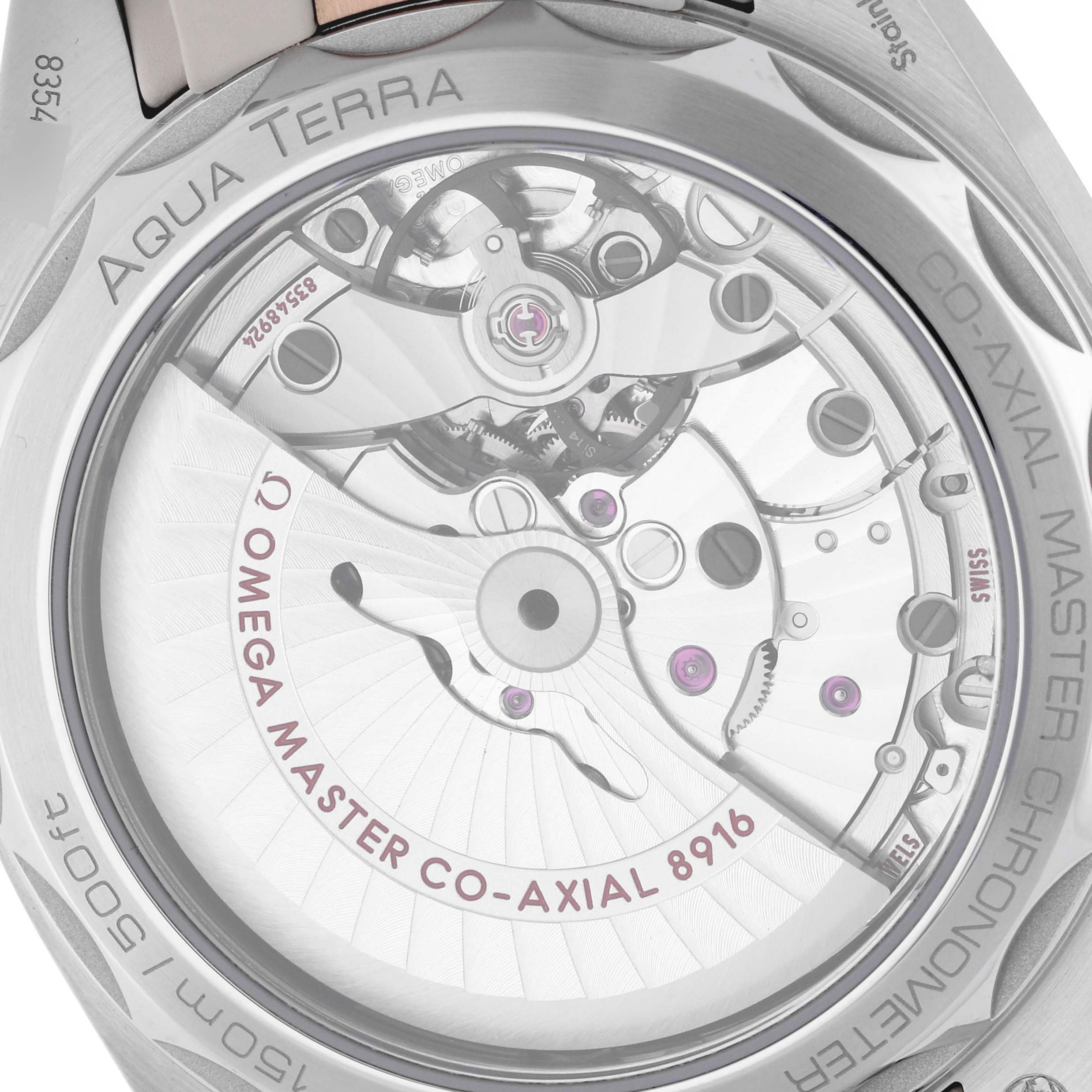 The image shows the back view of the Omega Aqua Terra 220.22.41.21.03.001 Men's Steel and Gold (two tone) Blue Dial 220.22.41.21.03.001 Men's Steel and Gold (two tone) Blue Dial watch, highlighting its movement mechanism.