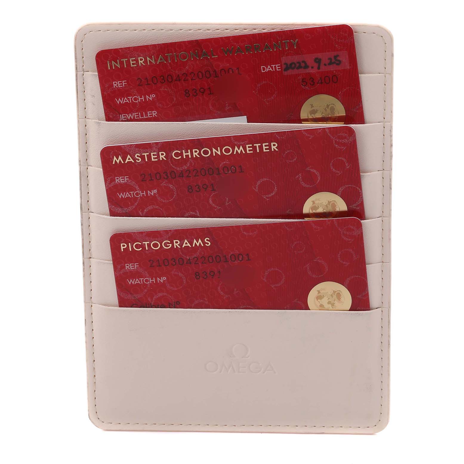 The image shows the warranty, chronometer, and pictogram cards for an Omega Seamaster 210.30.42.20.01.001 Men
s Stainless Steel Black Dial 210.30.42.20.01.001 Men
s Stainless Steel Black Dial watch.