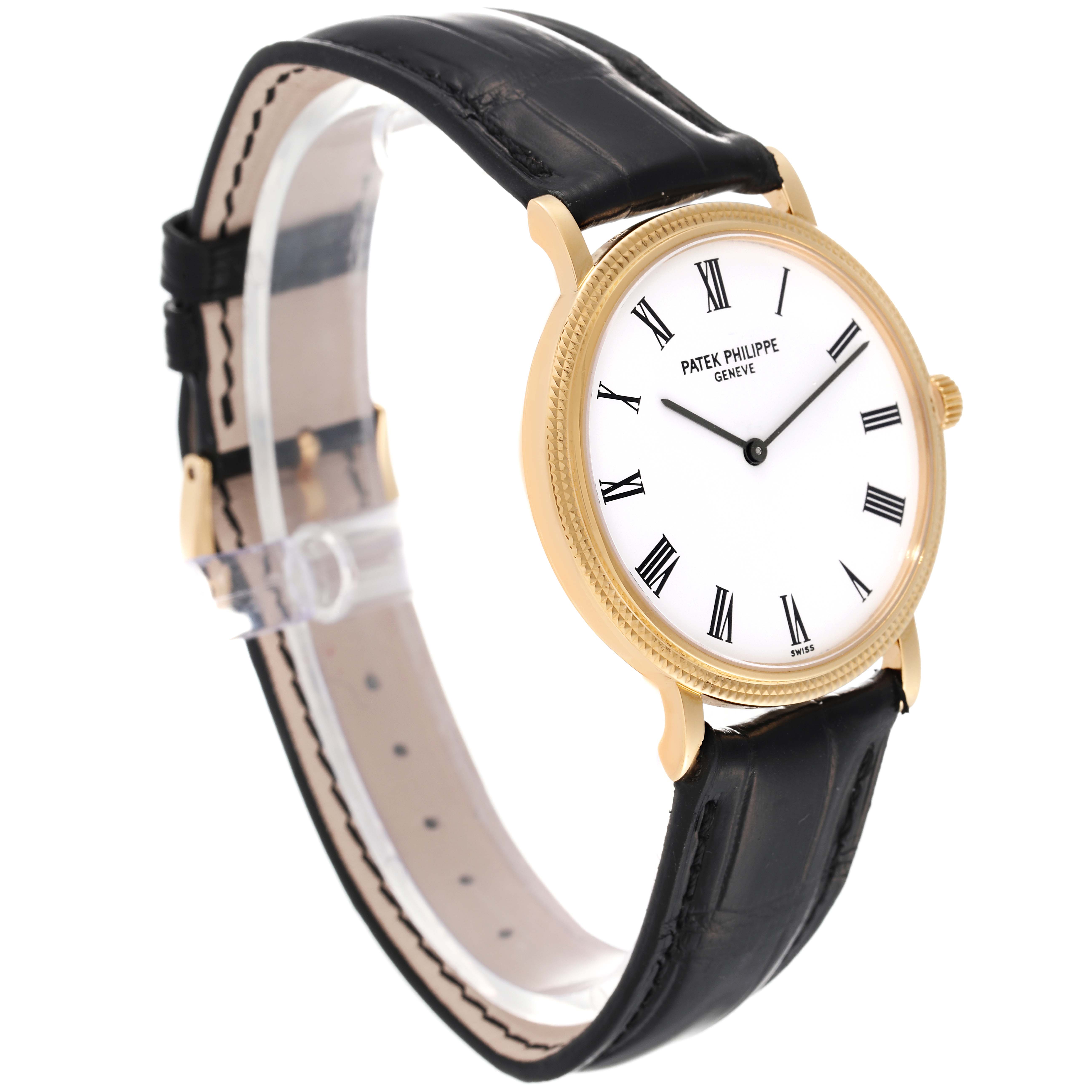 This image shows a side-angle view of the Patek Philippe Calatrava 5120J Men's Yellow Gold White Dial 5120J Men's Yellow Gold White Dial watch featuring its face, gold case, and black leather strap.