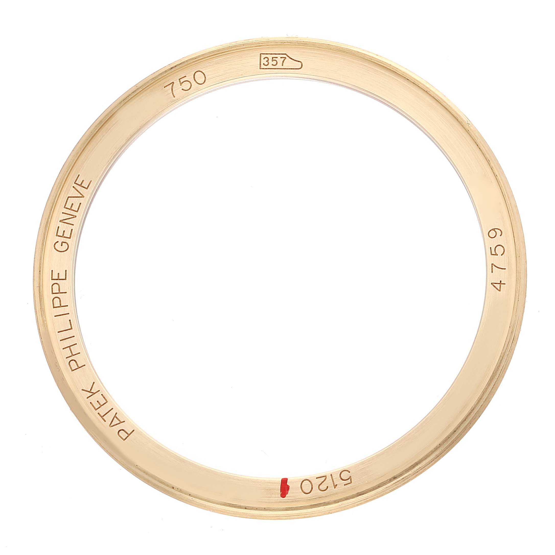 This image shows the gold bezel of a Patek Philippe Calatrava 5120J Men's Yellow Gold White Dial 5120J Men's Yellow Gold White Dial watch, with brand engravings visible.