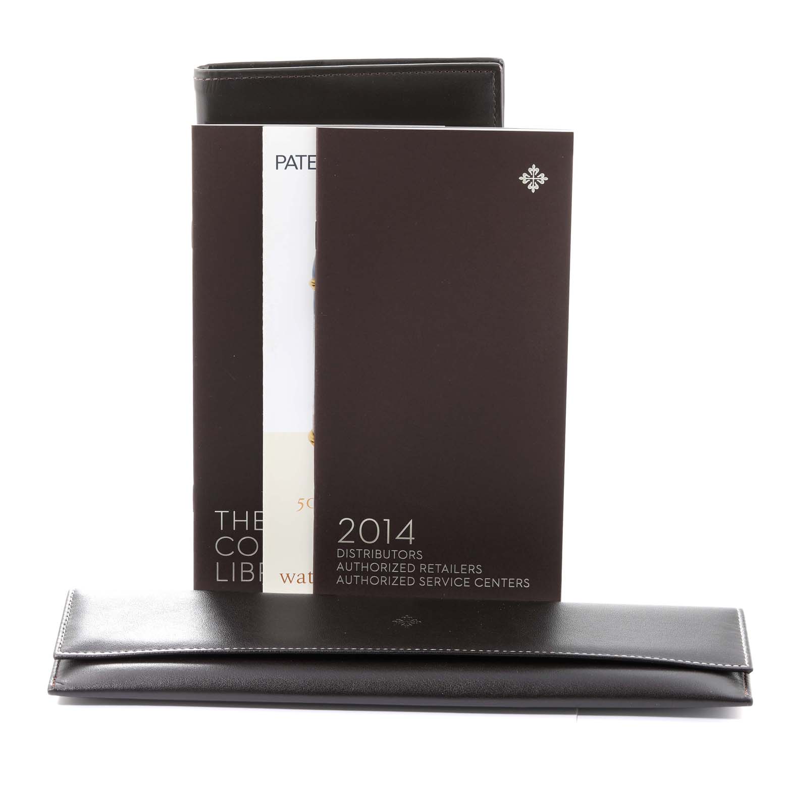 The image shows documentation and a leather case for the Calatrava model by Patek Philippe.