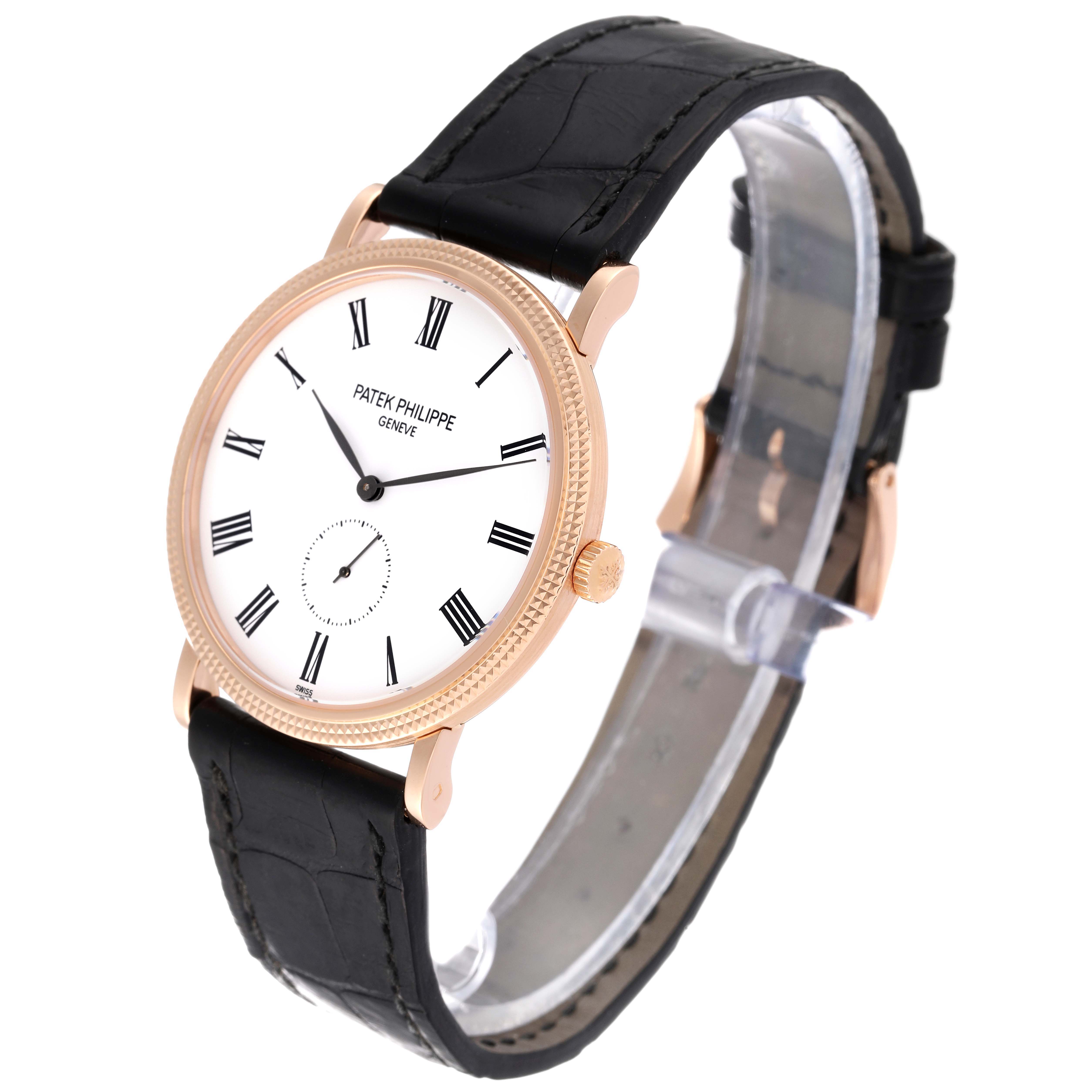 The Patek Philippe Calatrava 5119R-001 Men's Rose Gold White Dial 5119R-001 Men's Rose Gold White Dial watch is shown at a three-quarter angle, displaying its face, crown, and black leather strap.