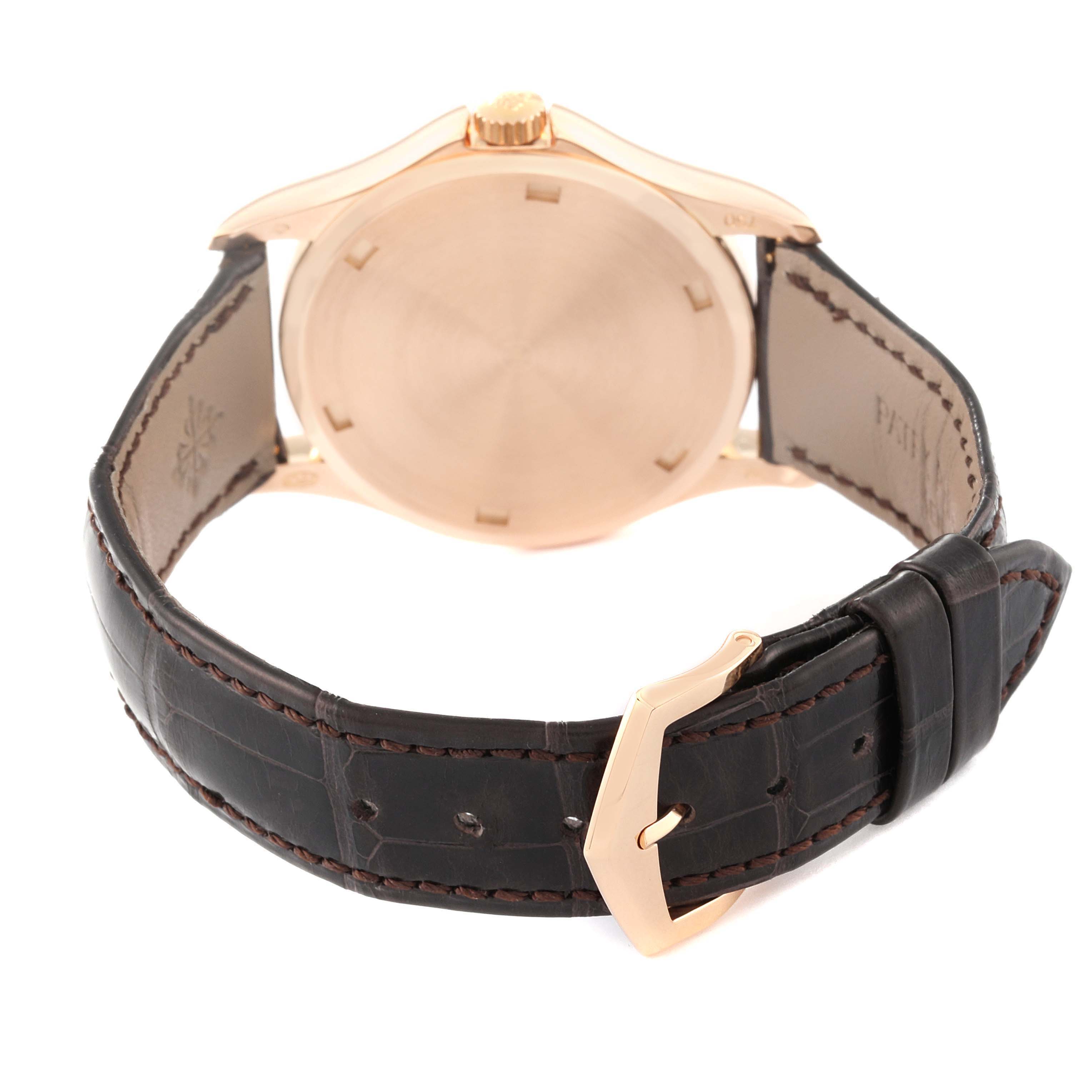 The image shows a rear view of a Patek Philippe Calatrava 5115R-001 Men's Rose Gold White Dial watch, highlighting its closed case back, leather strap, and buckle.