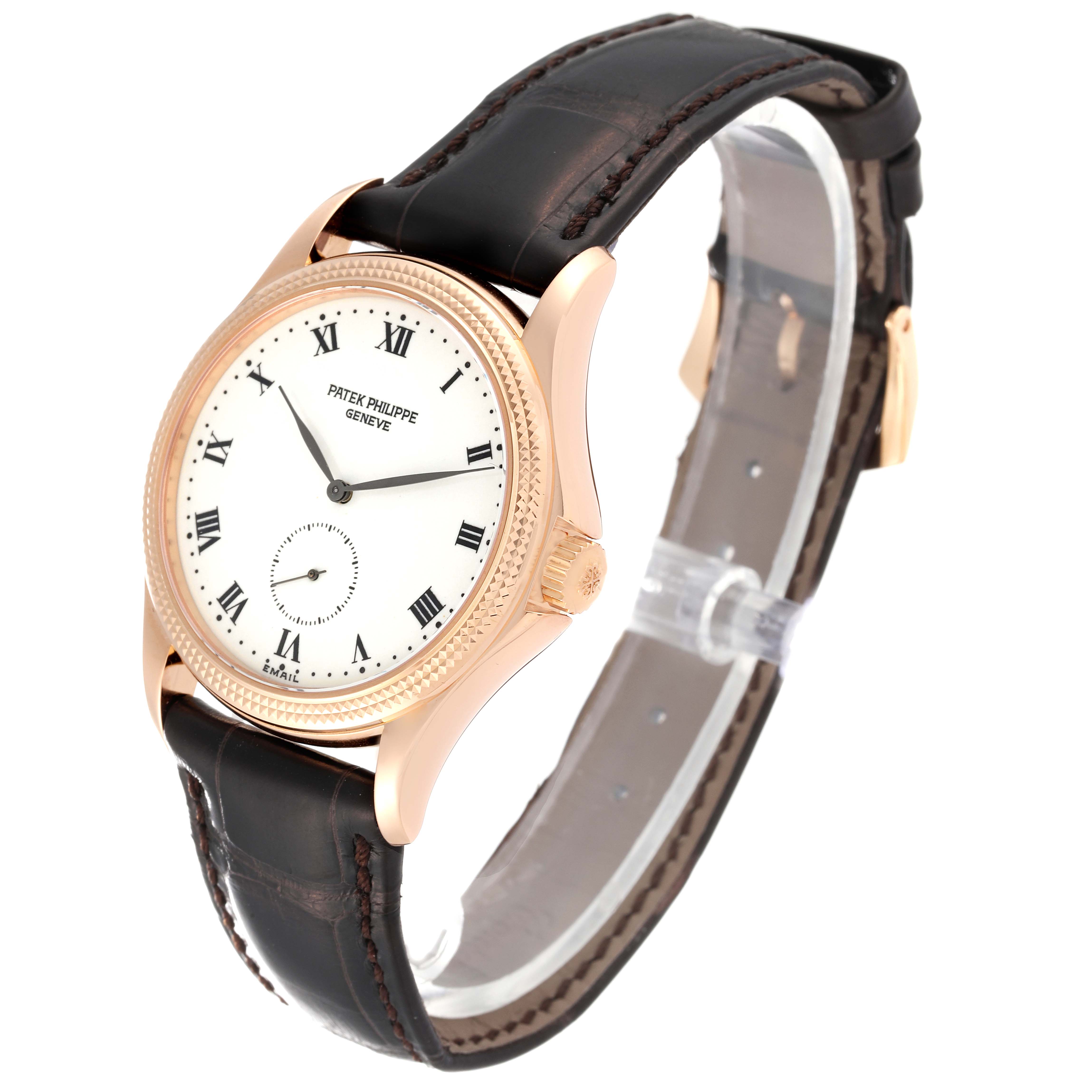 The image shows a Patek Philippe Calatrava 5115R-001 Men
s Rose Gold White Dial 5115R-001 Men
s Rose Gold White Dial watch angled from the front left, highlighting its dial, case, and leather strap.