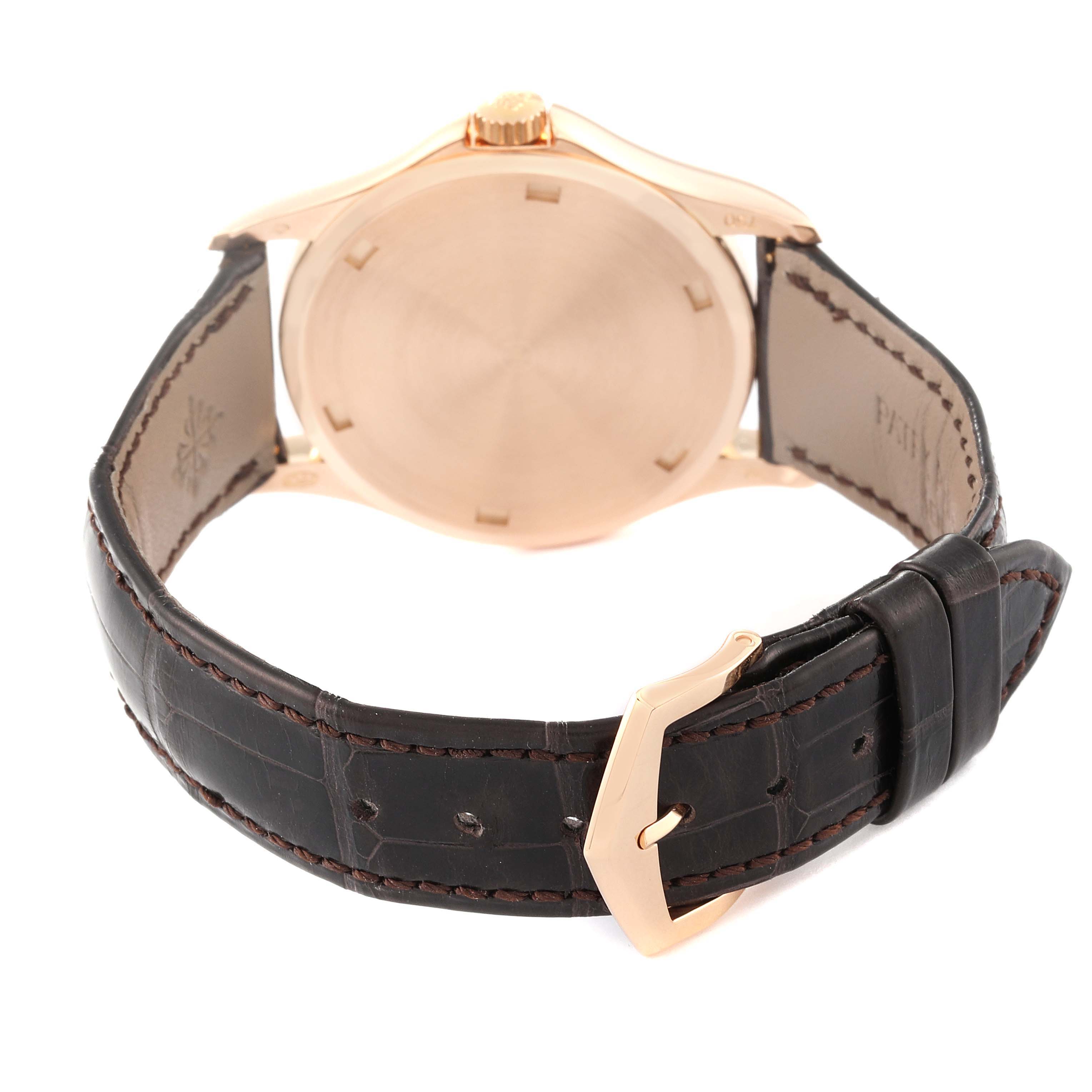 The image shows the rear view of a Patek Philippe Calatrava 5115R-001 Men
s Rose Gold White Dial 5115R-001 Men
s Rose Gold White Dial watch, highlighting the case back, strap, and buckle.