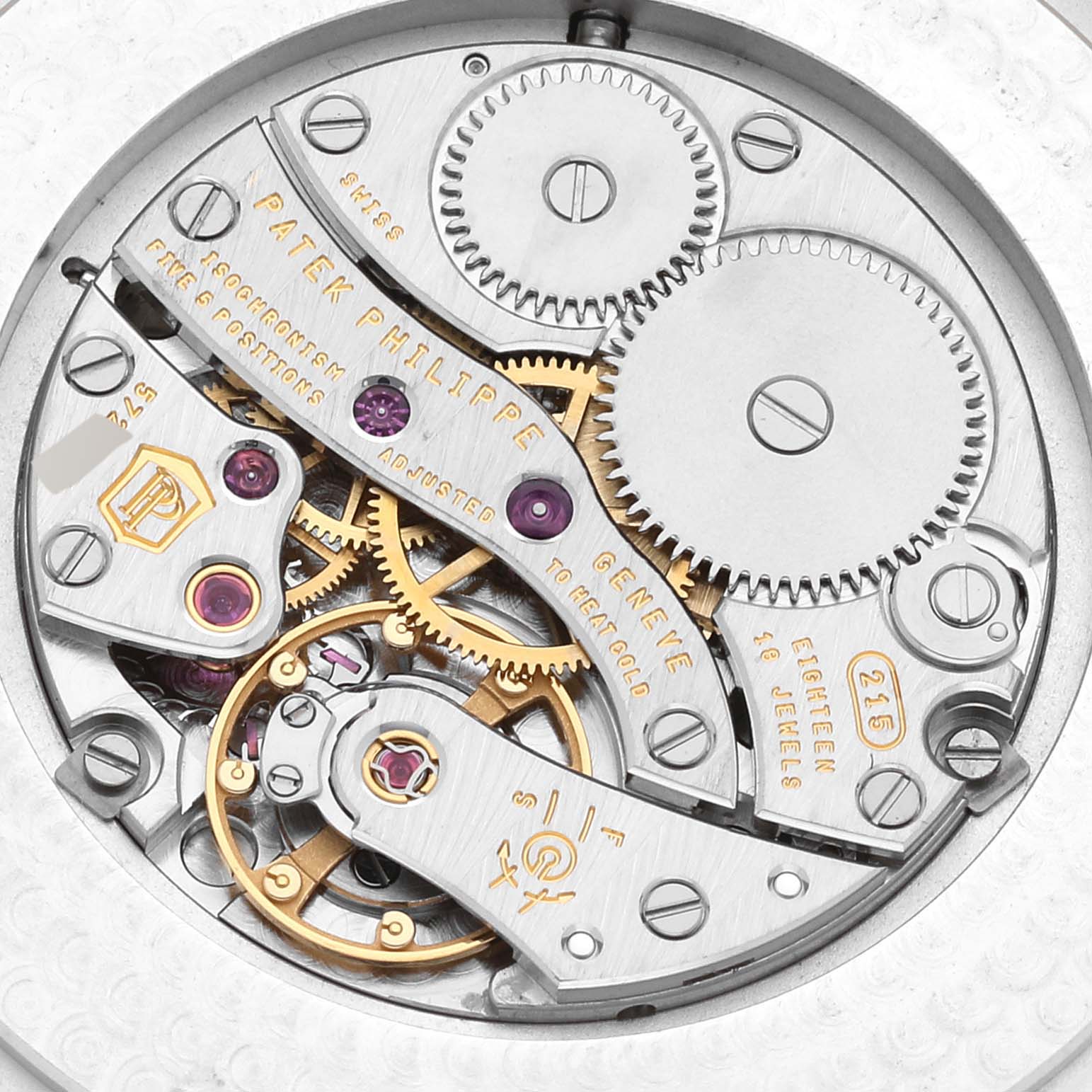 This image shows the intricate mechanical movement of a Patek Philippe Calatrava 5196J Men's Yellow Gold Silver Dial 5196J Men's Yellow Gold Silver Dial watch from a close-up angle.