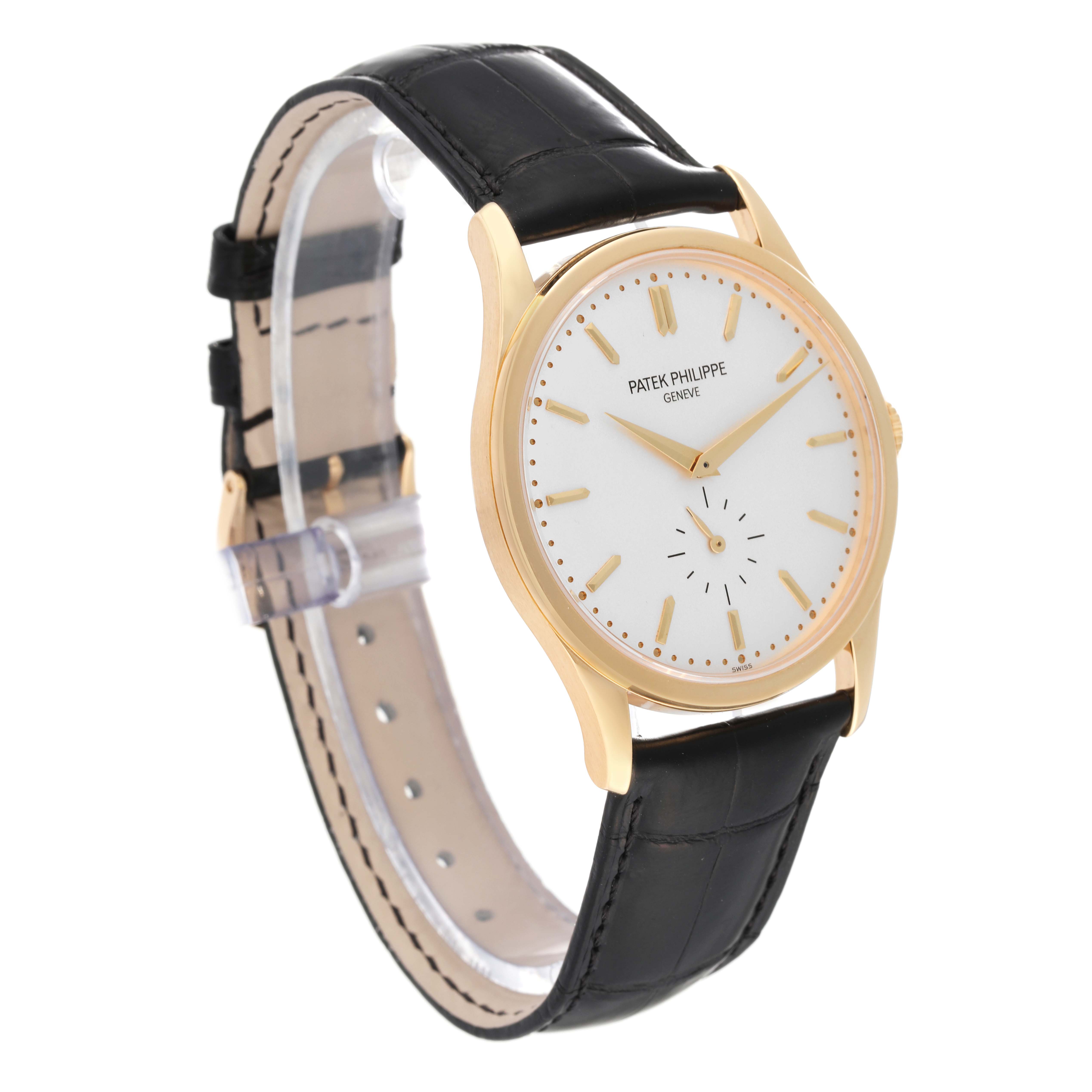 The image shows a Patek Philippe Calatrava 5196J Men's Yellow Gold Silver Dial 5196J Men's Yellow Gold Silver Dial watch at a three-quarter angle highlighting its dial, case, and black leather strap.