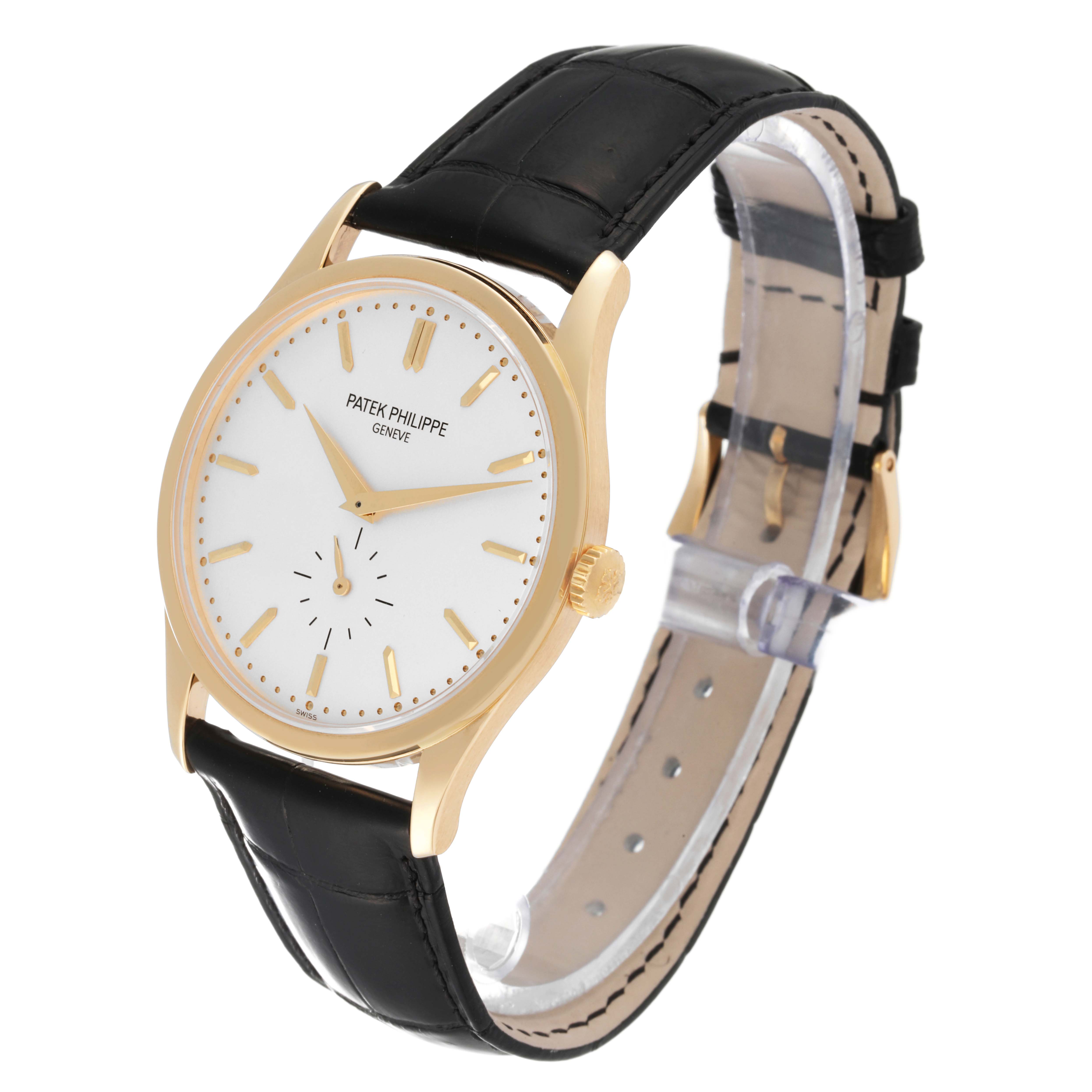 The image shows a Patek Philippe Calatrava 5196J Men's Yellow Gold Silver Dial 5196J Men's Yellow Gold Silver Dial watch at a three-quarter angle, highlighting the dial, crown, and leather strap.