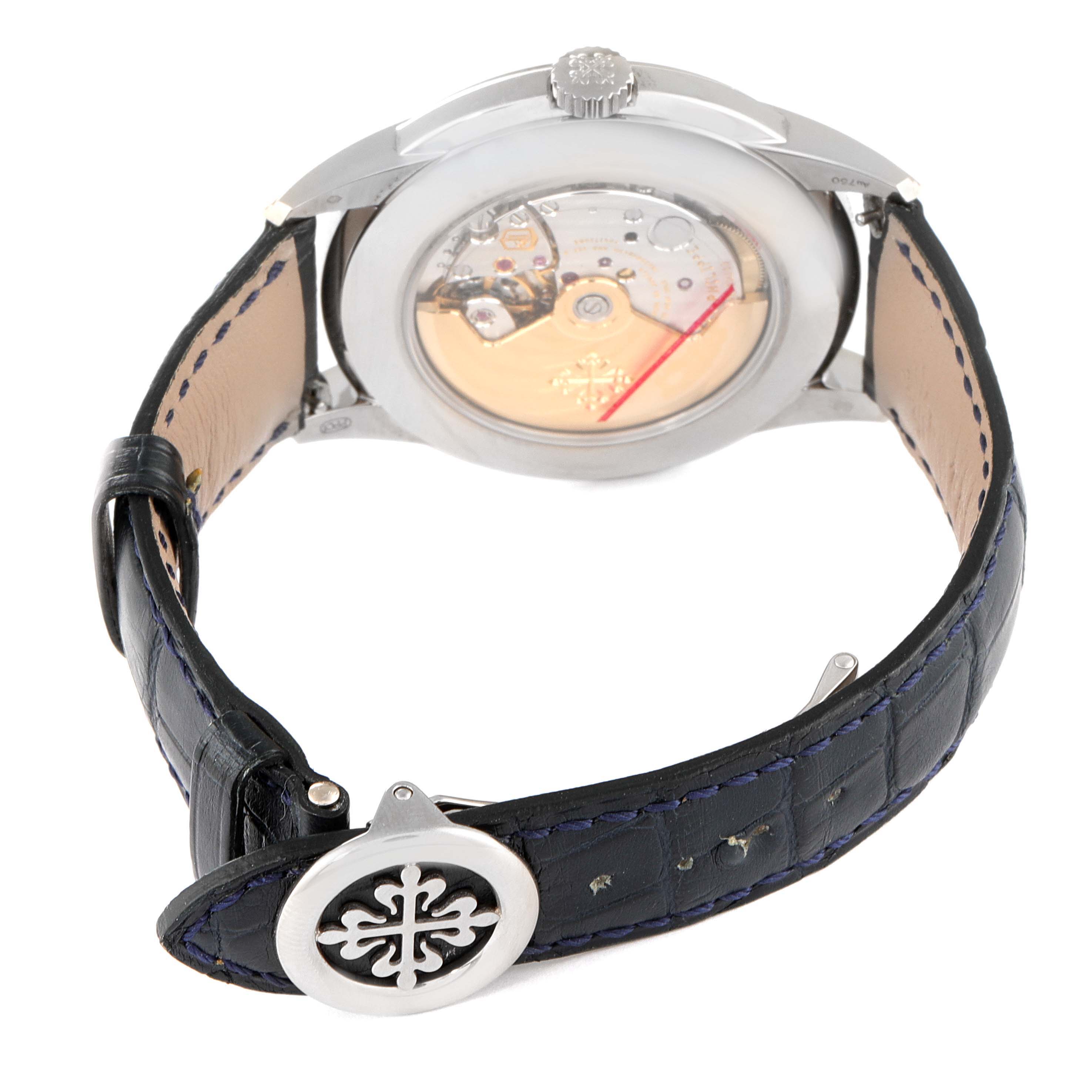 This image shows the back view of a Patek Philippe Complications 5320G-001 Men's White Gold Beige Dial 5320G-001 Men's White Gold Beige Dial watch, highlighting its movement and leather strap.