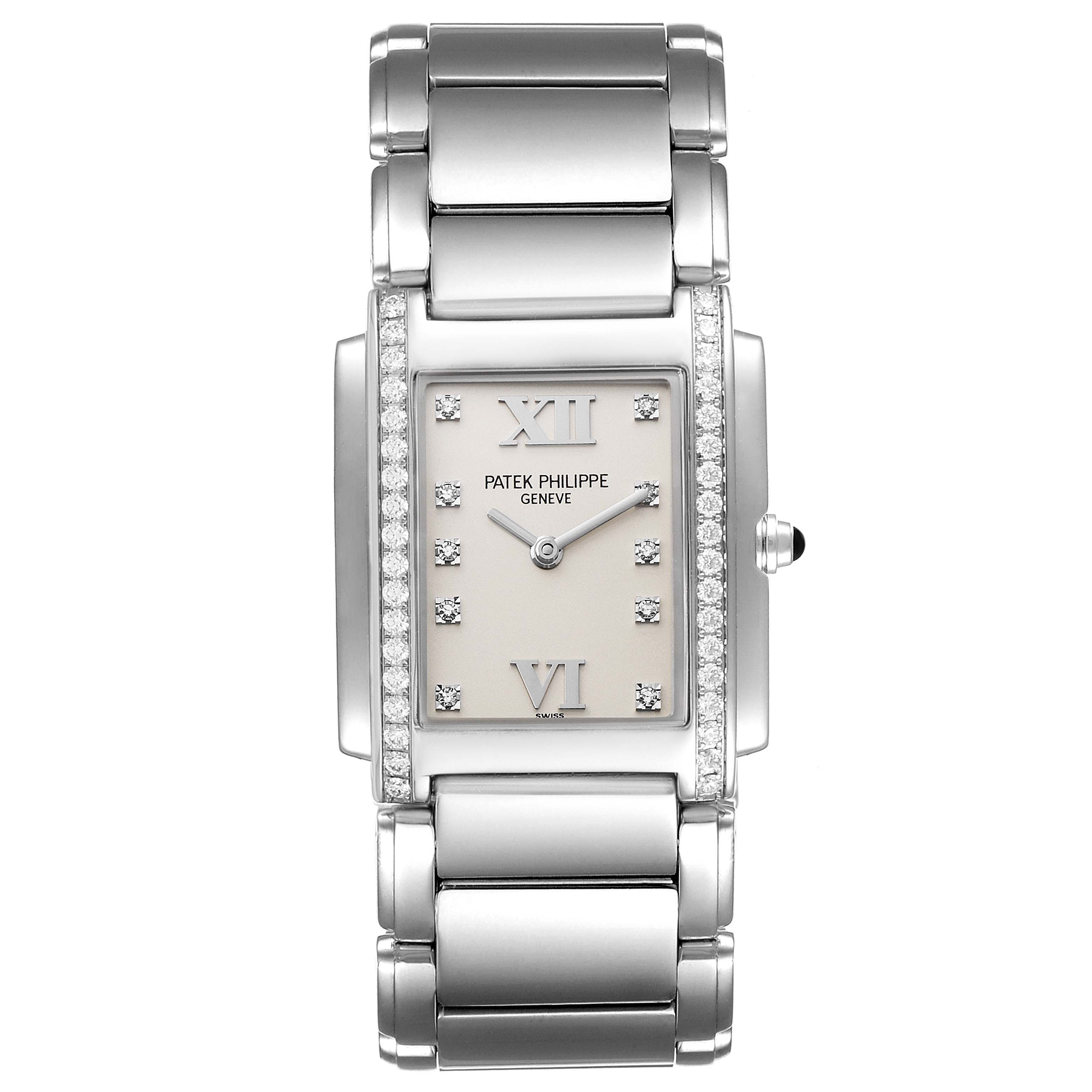 The image shows the front view of the Patek Philippe Twenty-4 4910/10A-010 Women's Stainless Steel Silver Dial 4910/10A-010 Women's Stainless Steel Silver Dial watch, displaying its face, bracelet, and side crown.
