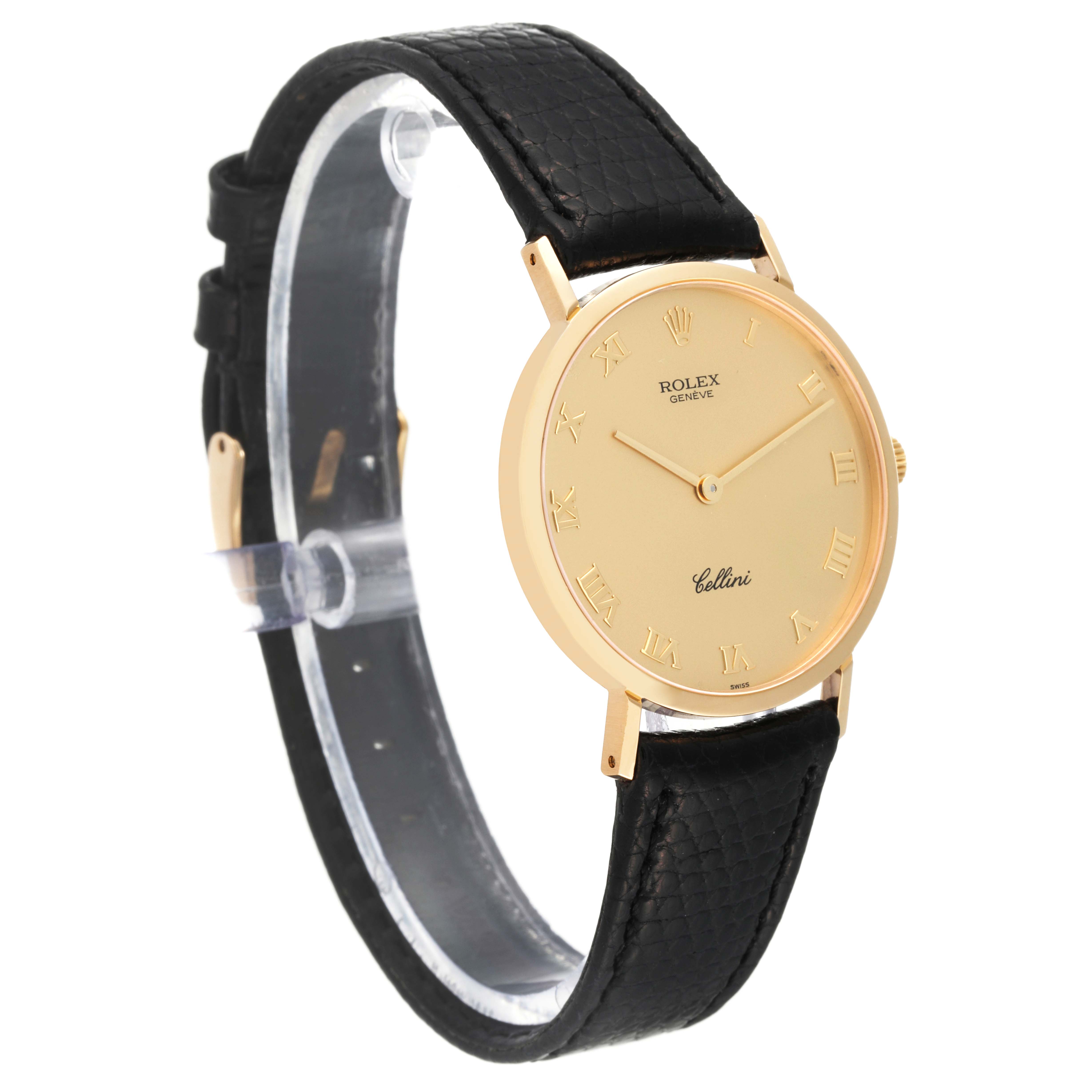 The Rolex Cellini 4112 Men's Yellow Gold Champagne Dial 4112 Men's Yellow Gold Champagne Dial watch is shown at a slight angle, displaying its gold round face and black leather strap.