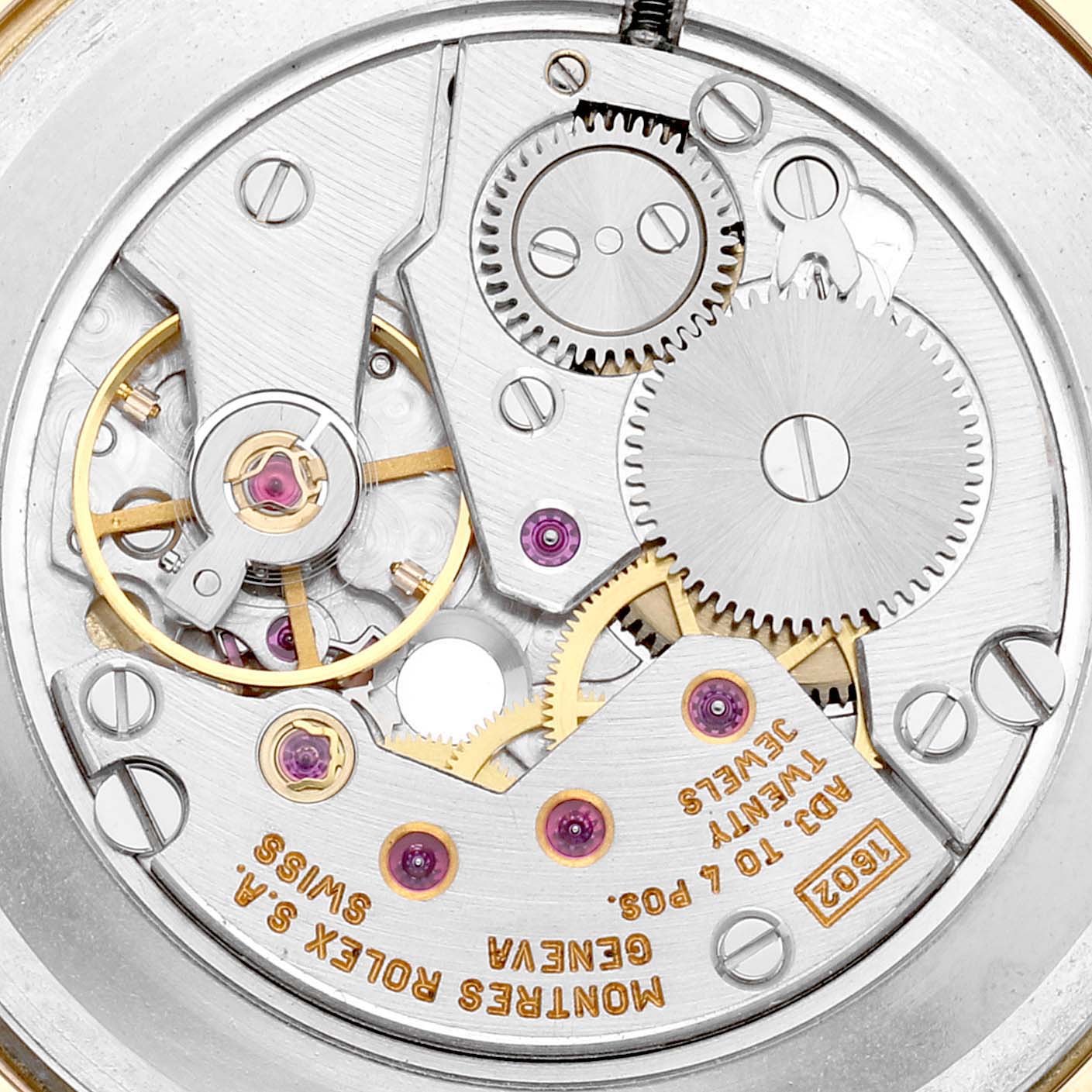 This is a close-up of the movement mechanism of a Rolex Cellini 4112 Men's Yellow Gold Champagne Dial 4112 Men's Yellow Gold Champagne Dial watch, showcasing gears, screws, and jewels.