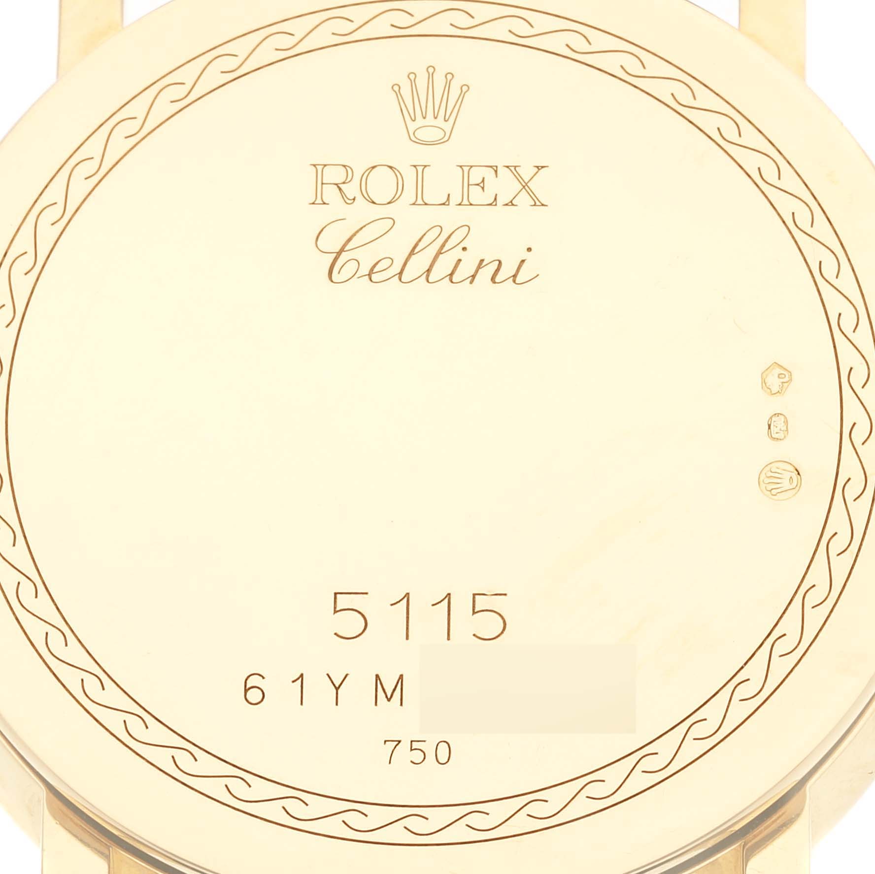 This image shows the back case of a Rolex Cellini 5115/8 Men's Yellow Gold White Dial 5115/8 Men's Yellow Gold White Dial watch, highlighting the model number and other engravings.