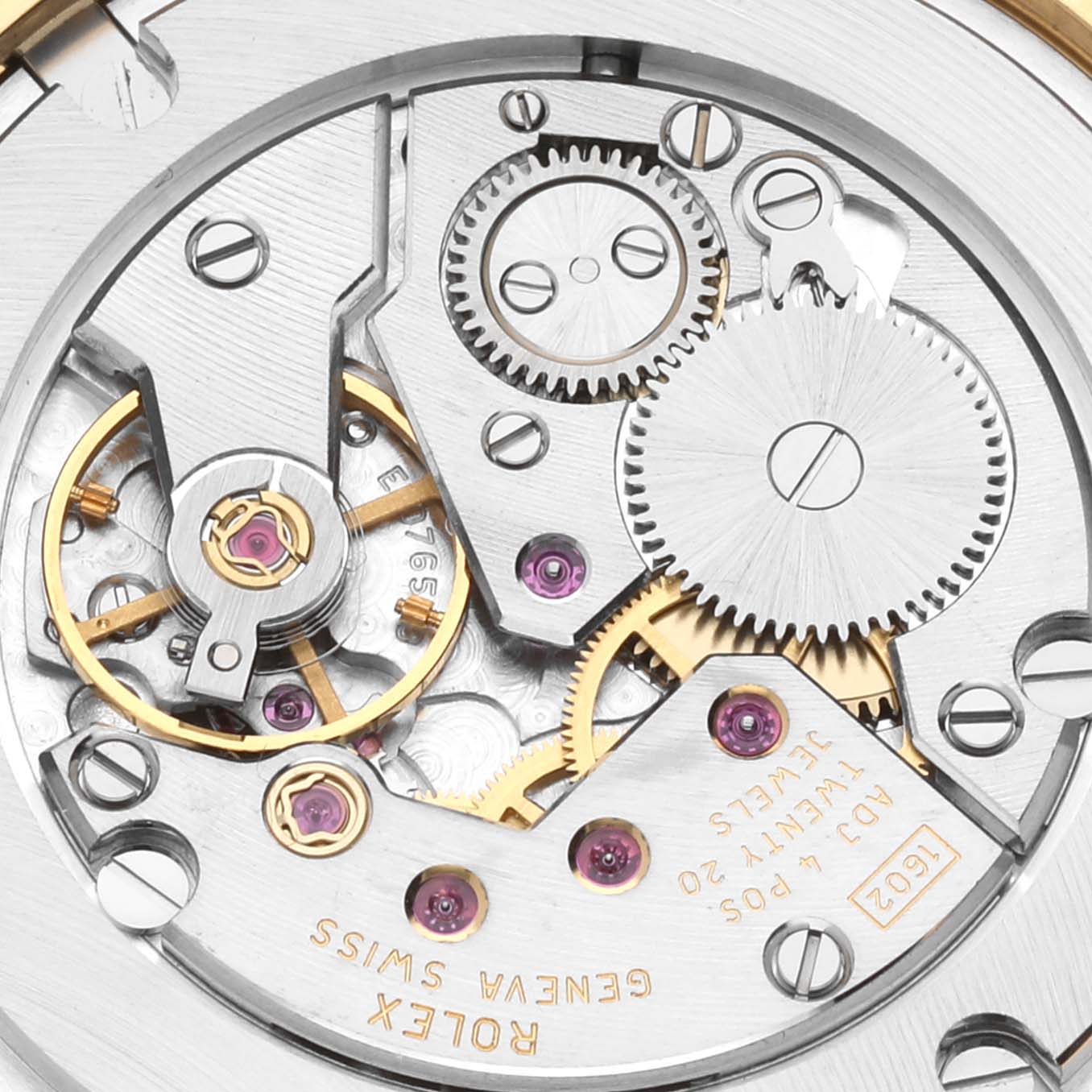 This image shows a close-up of the movement mechanism of a Rolex Cellini 5115/8 Men's Yellow Gold White Dial 5115/8 Men's Yellow Gold White Dial watch, highlighting its gears and intricate components.