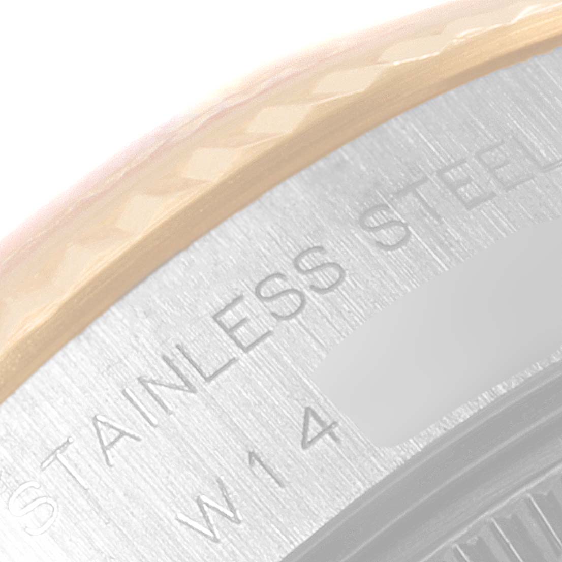 This image shows a close-up of the case back and part of the gold bezel of a Rolex Datejust 69173 Women
s Steel and Gold (two tone) Champagne Dial 69173 Women
s Steel and Gold (two tone) Champagne Dial watch.