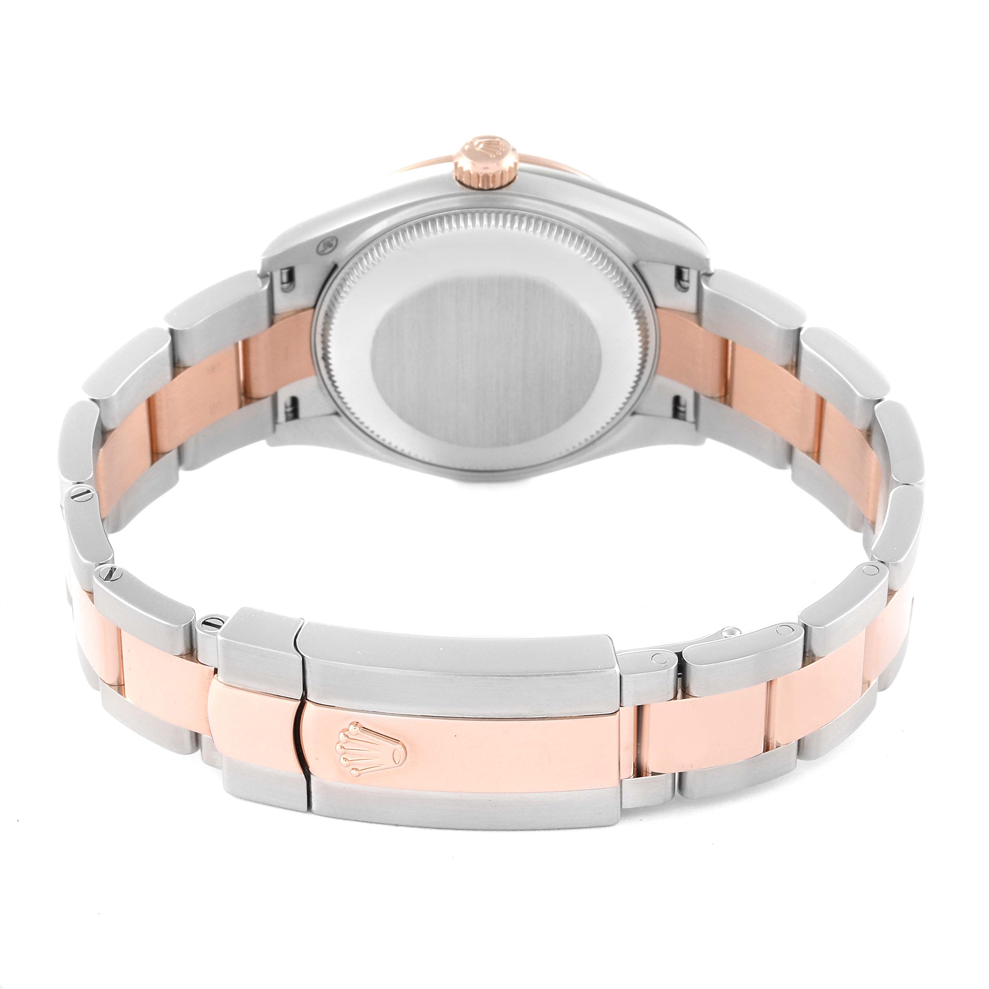 The image shows the back and bracelet of a Mid-Size Rolex watch in a steel and rose gold color.