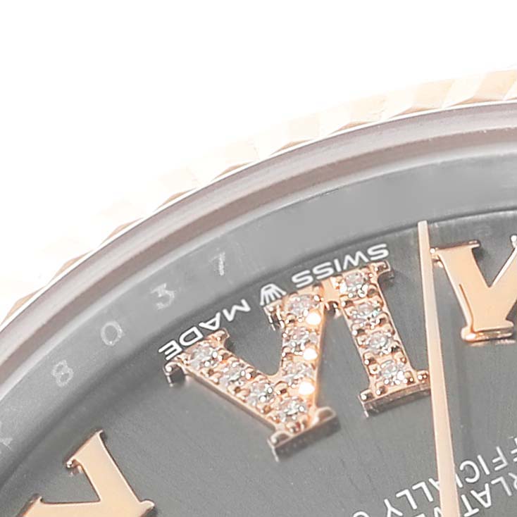 The image shows a close-up angle of the dial on a Mid-Size Rolex watch, focusing on its Roman numeral markers and detailing.