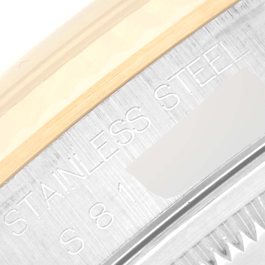 The image shows a close-up of the side of a Rolex Datejust 16233 Men's Steel and Gold (two tone) Black Dial 16233 Men's Steel and Gold (two tone) Black Dial, highlighting the "Stainless Steel" text engraving on the case.