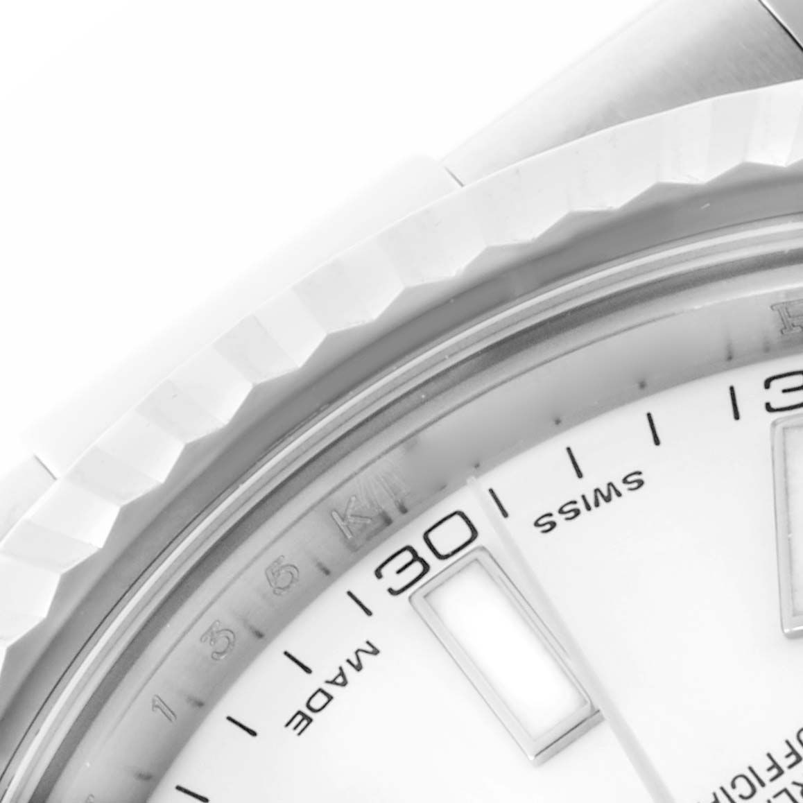 The image shows a close-up of the dial and fluted bezel of the Rolex Datejust 41 116334 Men's Stainless Steel White Dial 116334 Men's Stainless Steel White Dial, focusing on the date and hour markers.