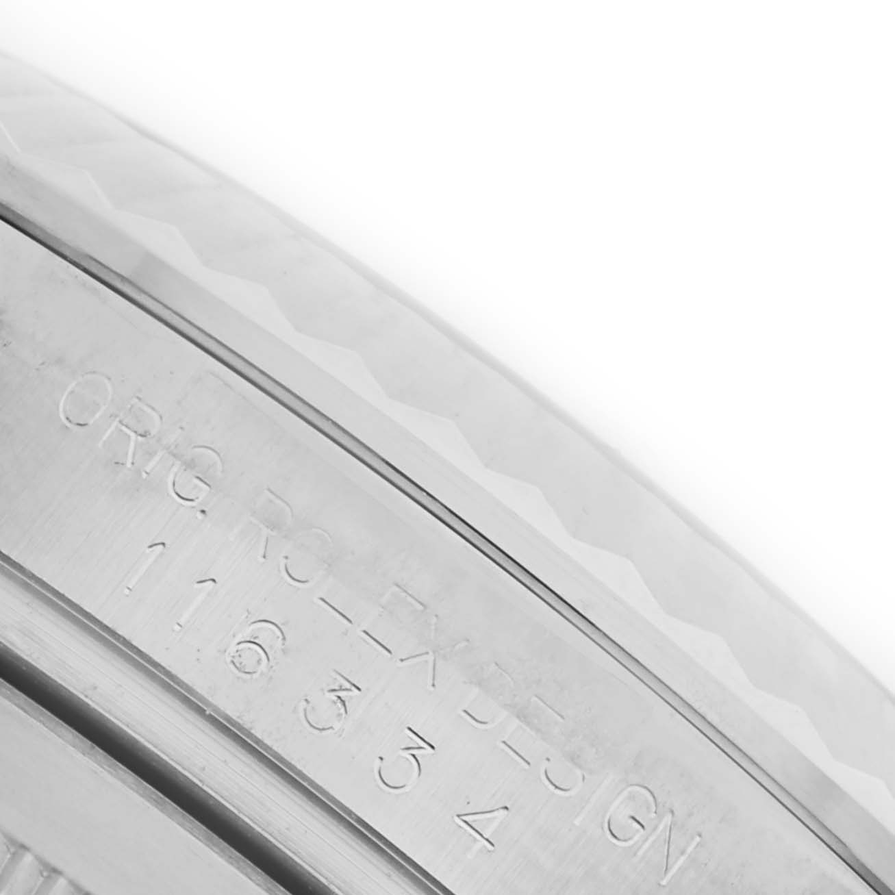 The image shows a close-up of the engraved bezel on a Rolex Datejust 41 116334 Men's Stainless Steel White Dial 116334 Men's Stainless Steel White Dial watch.