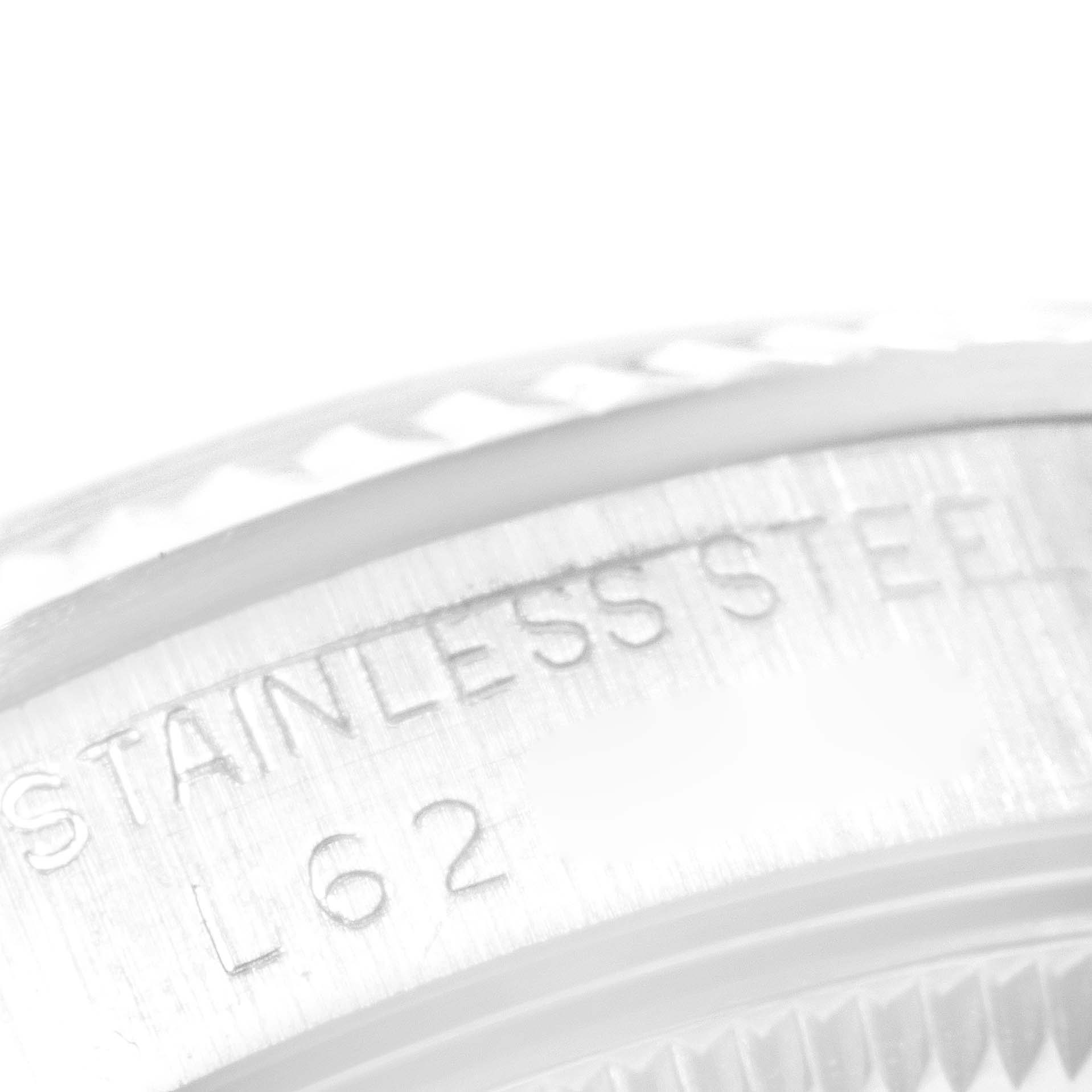 This close-up image shows the stainless steel bezel and caseback of a Rolex Mid-Size 68274 Women
s Stainless Steel White Dial 68274 Women
s Stainless Steel White Dial watch.