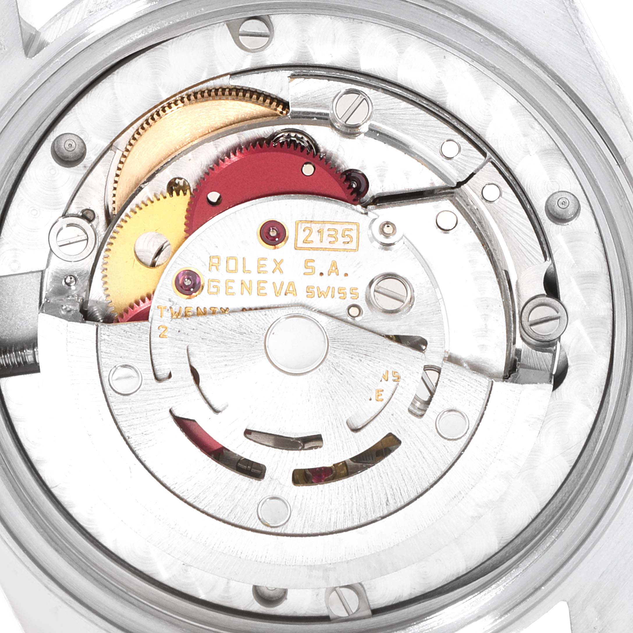 The image shows a close-up view of the movement inside a Mid-Size Rolex watch, featuring gears and intricate components.