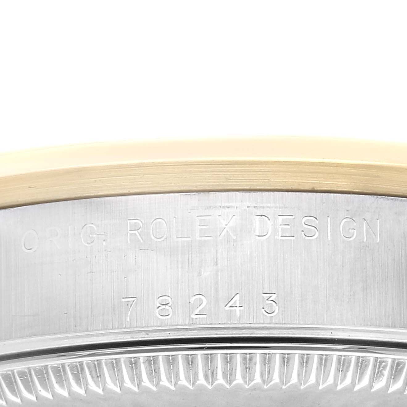 The image shows a close-up of the engraved serial number and the words "ORIG. ROLEX DESIGN" on the case back edge of a Mid-Size Rolex watch.