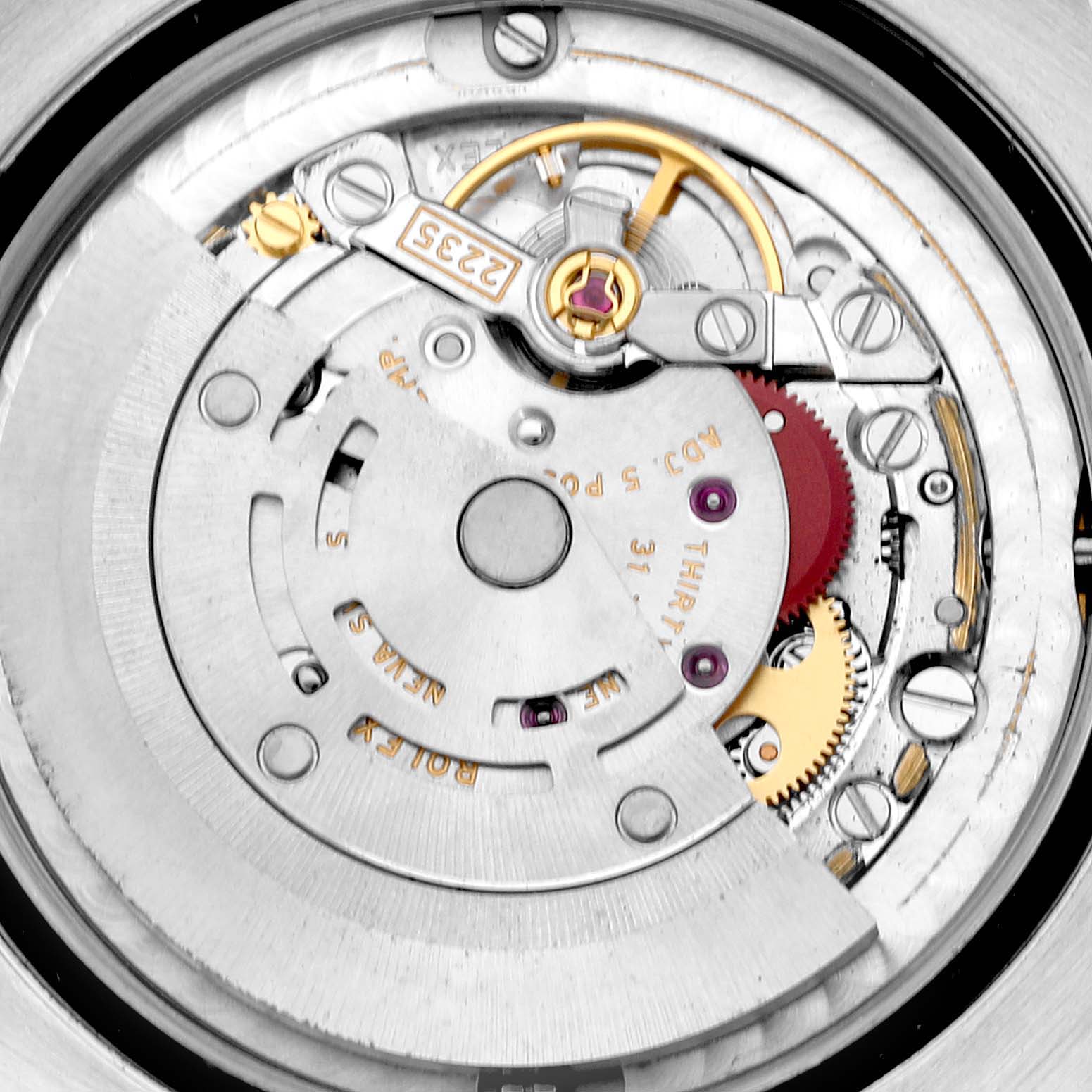 The image shows the internal movement mechanism of a mid-size Rolex watch.