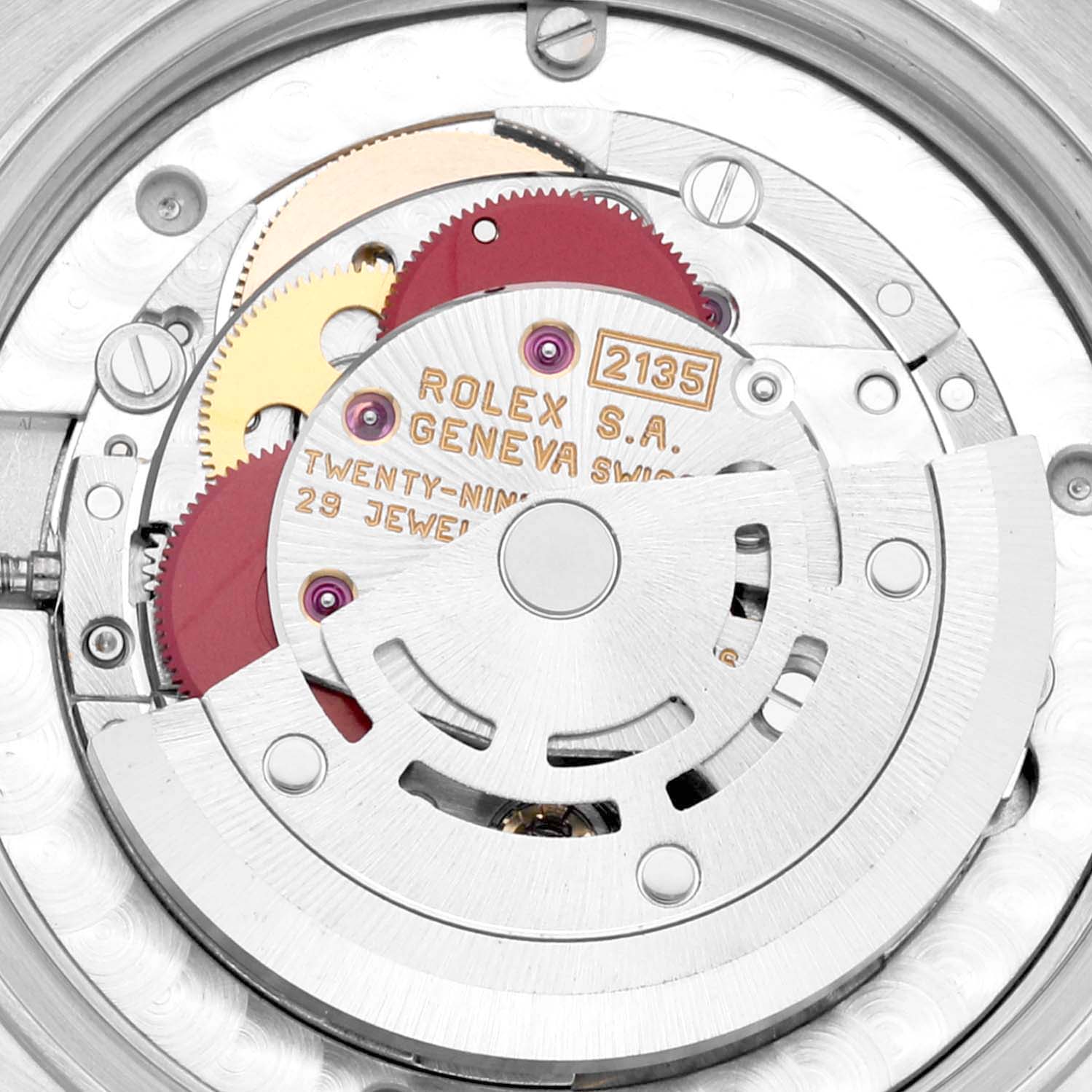 The image shows the intricate internal mechanics of a Rolex Mid-Size 68273 Women's Steel and Gold (two tone) Blue Dial 68273 Women's Steel and Gold (two tone) Blue Dial model, showcasing gears and engravings, viewed from the back case.