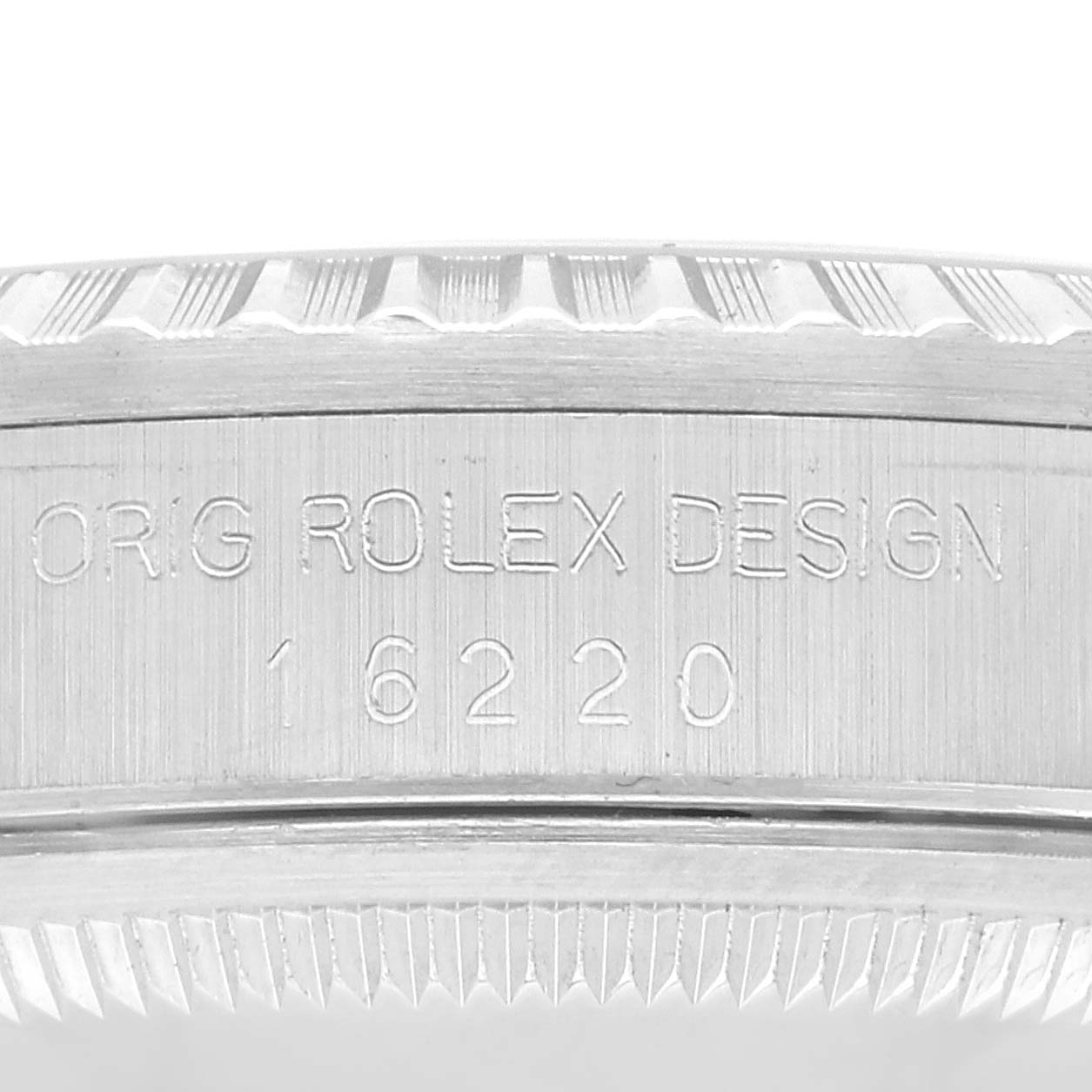 The image shows a close-up angle of the case side and part of the bezel of a Rolex Datejust 16220 Men's Stainless Steel Silver Dial 16220 Men's Stainless Steel Silver Dial model, displaying the engraving "ORIG ROLEX DESIGN 16220".