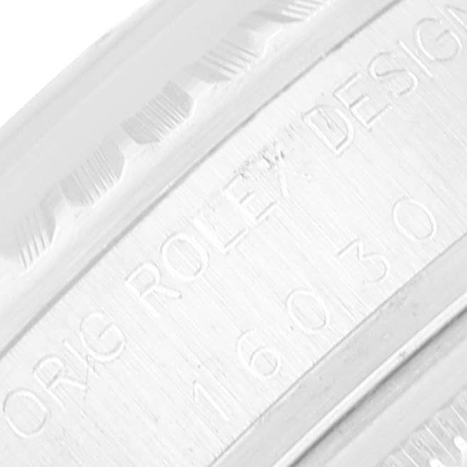 The image shows a close-up of the engraving on the side of a Rolex Vintage Collection 16030 Men
s Stainless Steel Silver Dial 16030 Men
s Stainless Steel Silver Dial model, highlighting the model and design details.